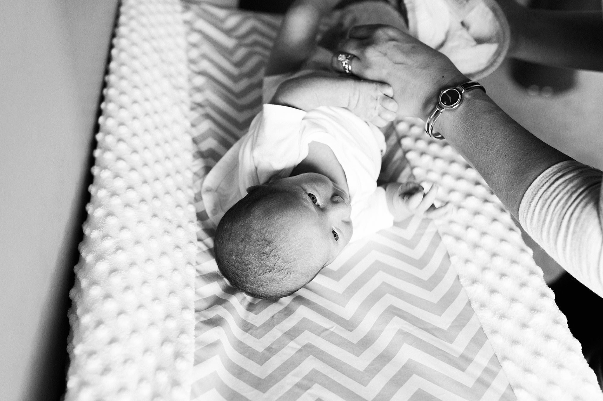 newborn on changing table