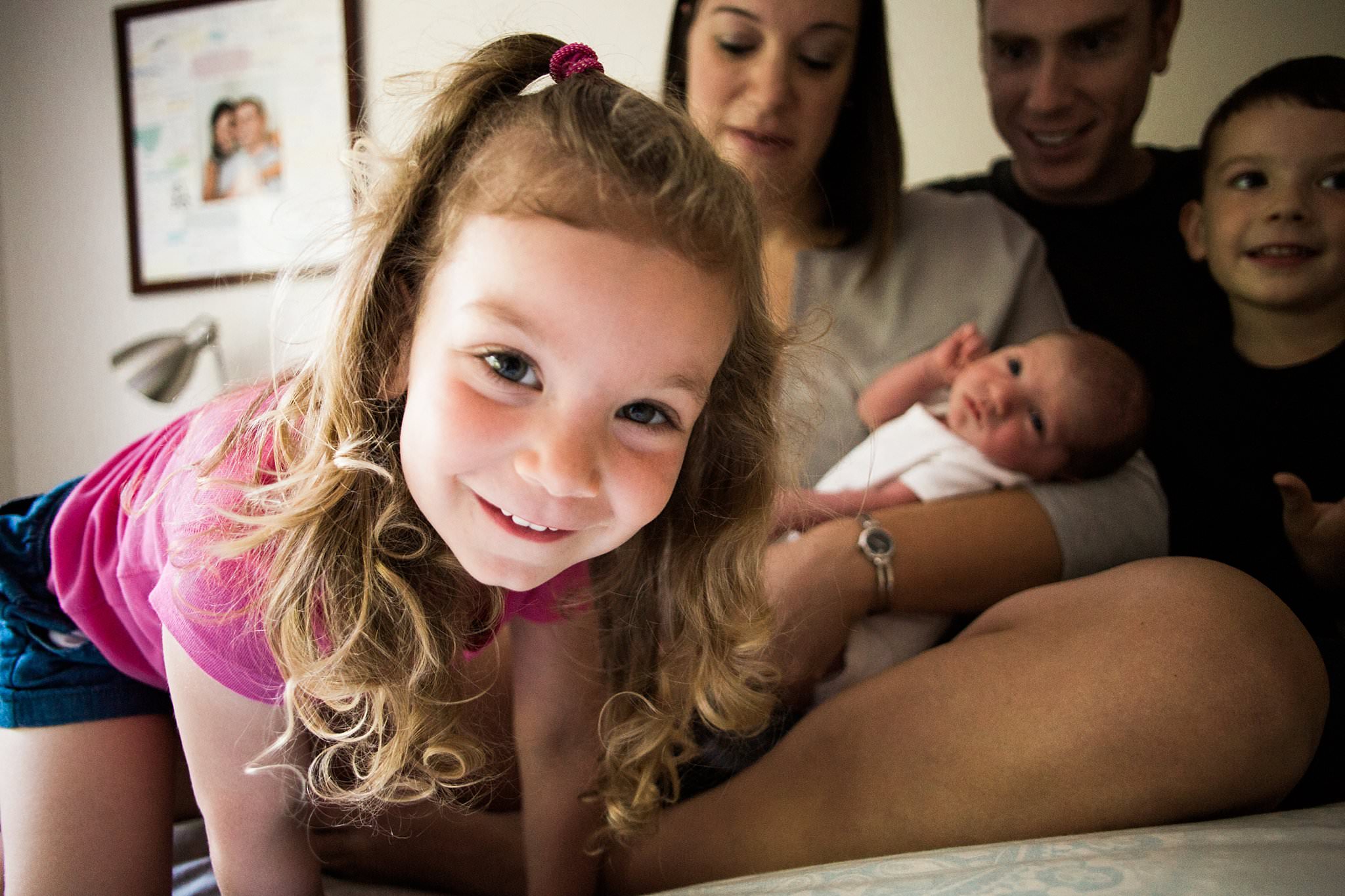 siblings and newborn in home photography