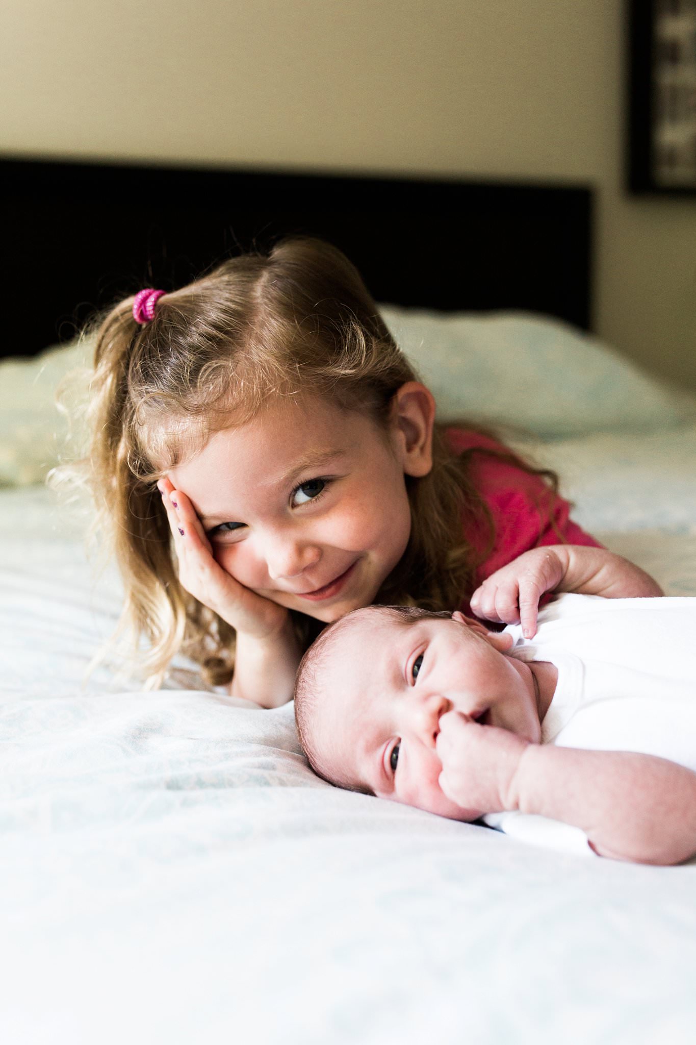 siblings and newborn in home photography