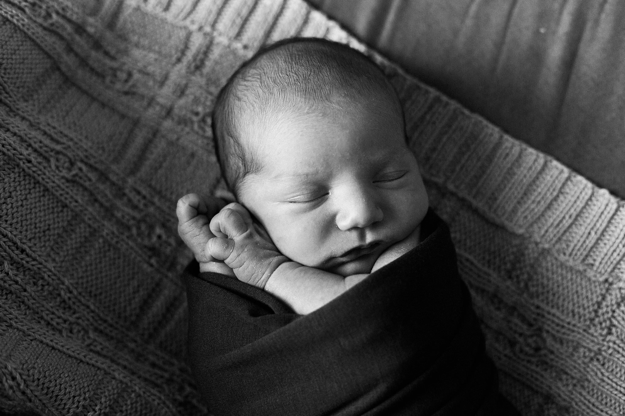 natural photo of newborn on handmade blanket