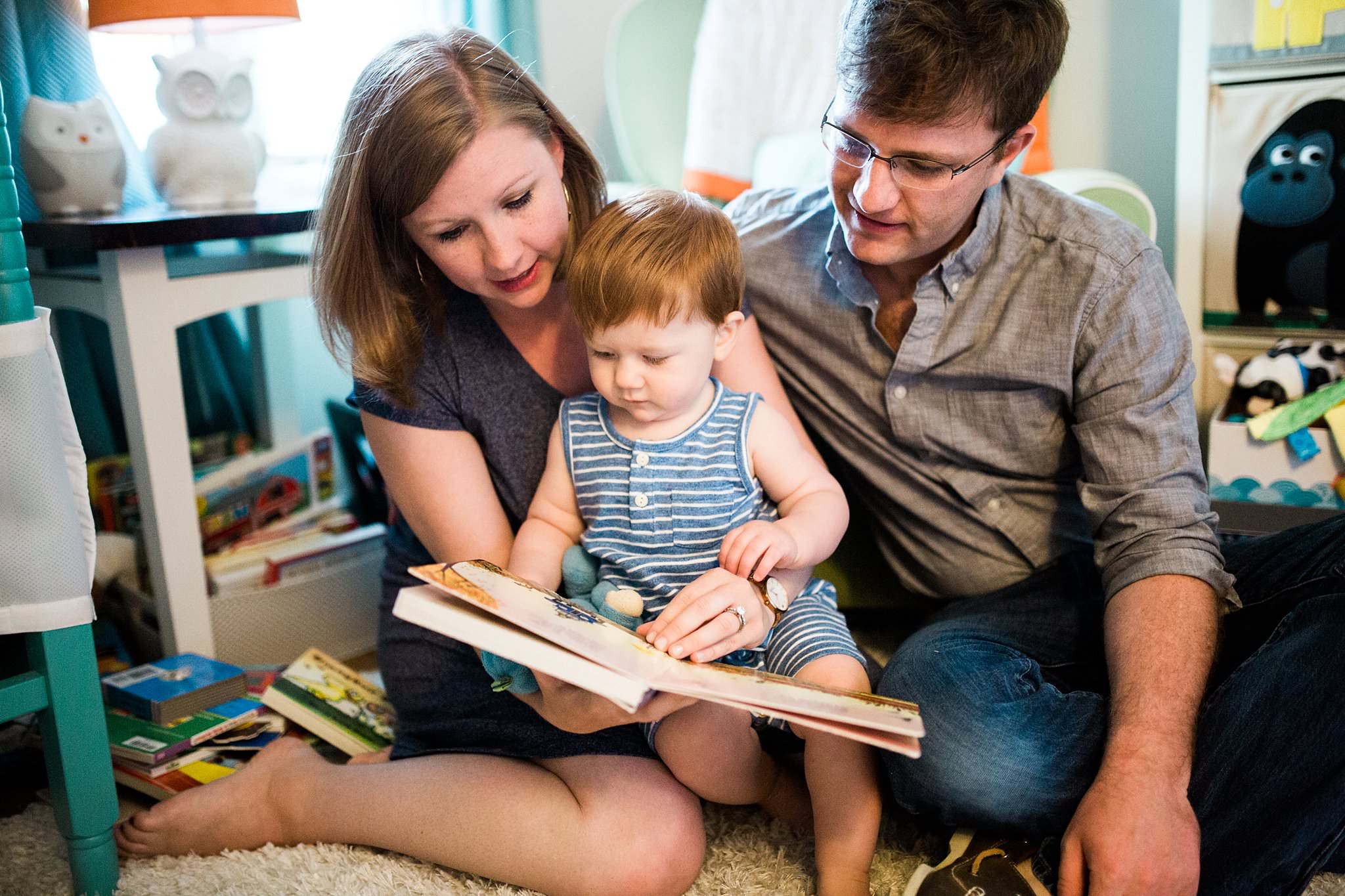 Photo of family reading in their home in pittsburgh