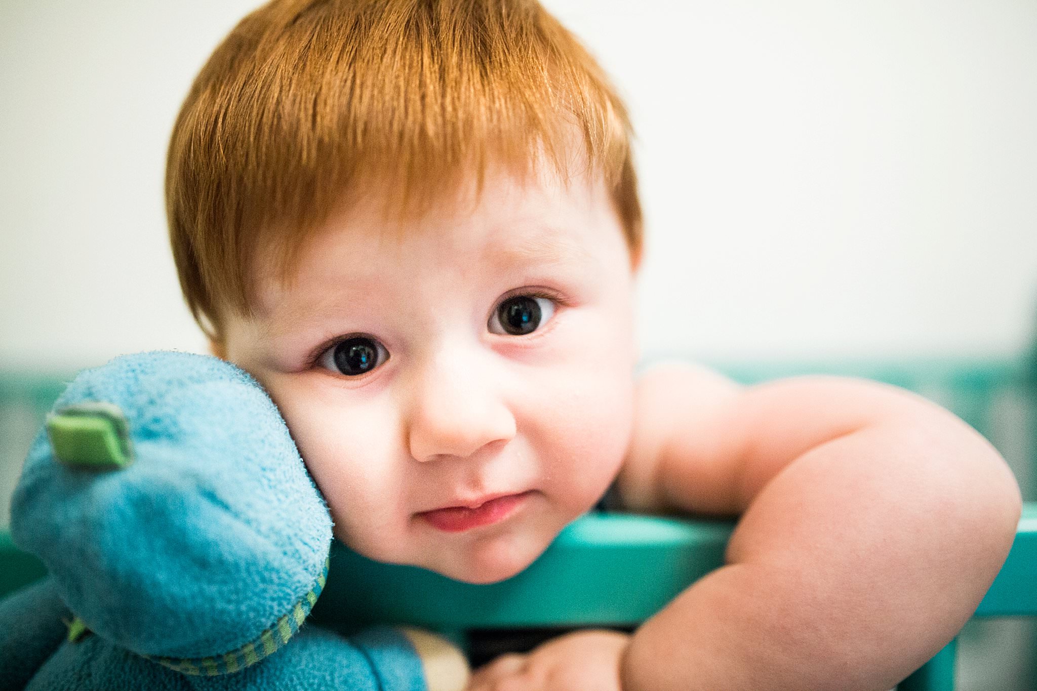 one year old in nursery crib