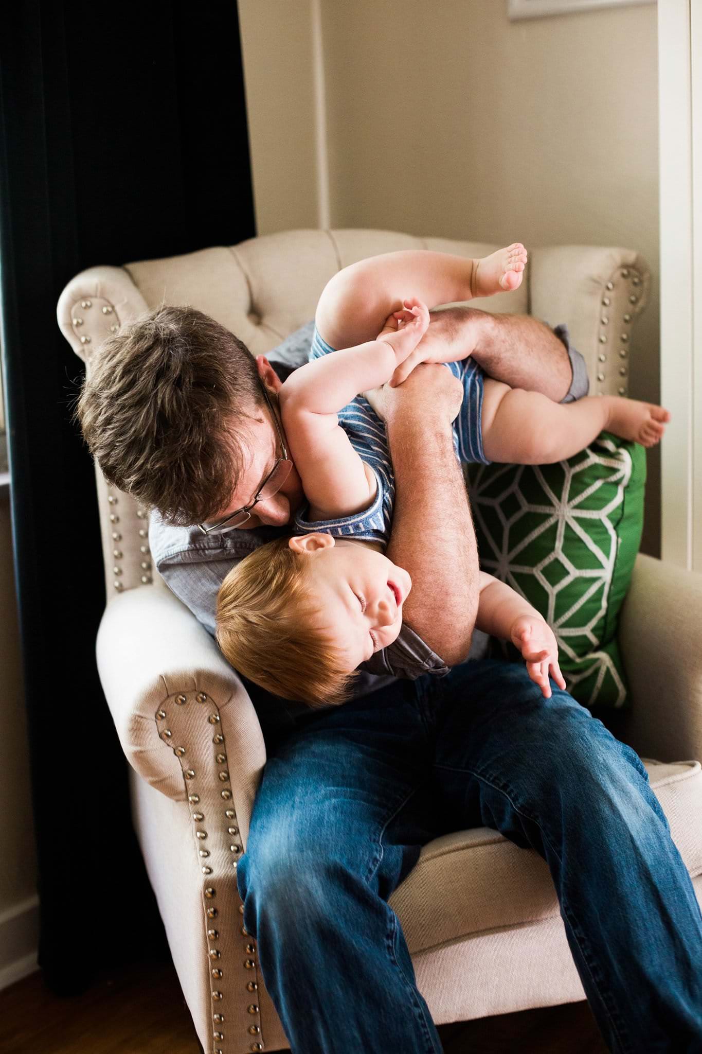 photo of father and son laughing 