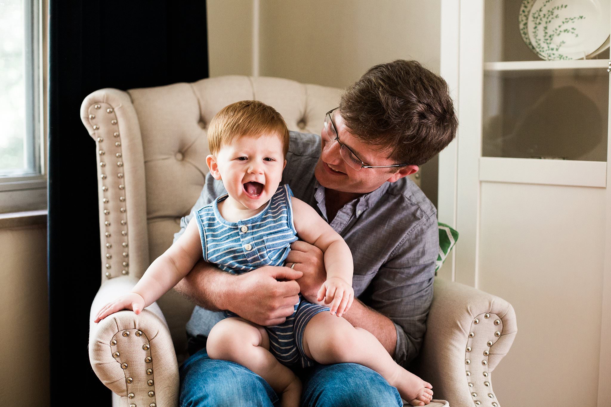 photo of father and son laughing 