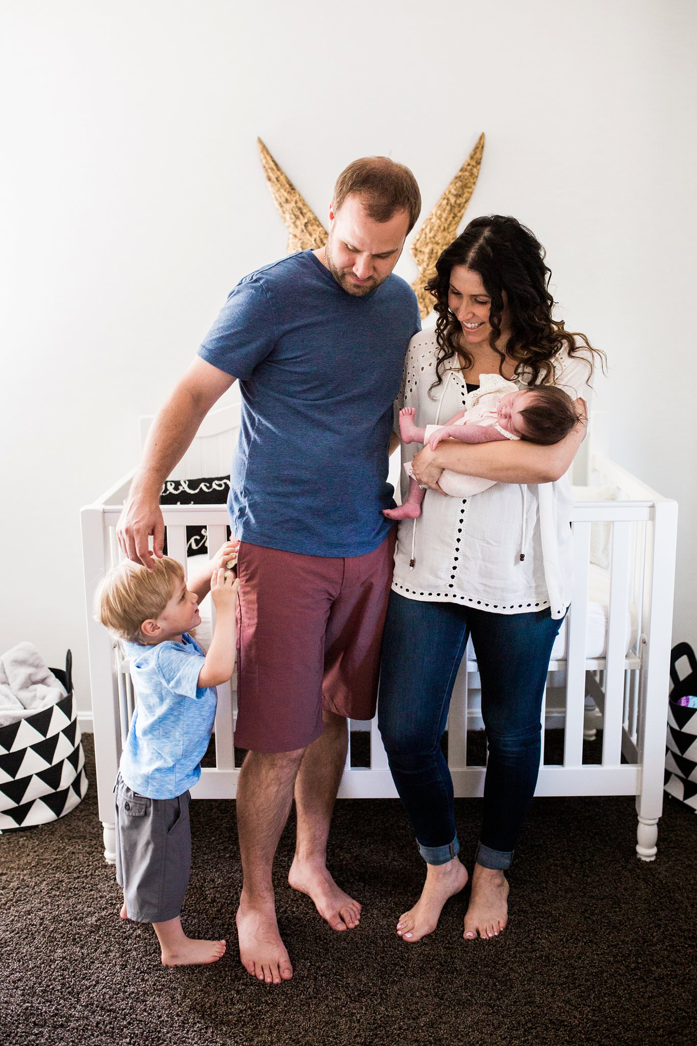 lifestyle family photos in beautiful nursery