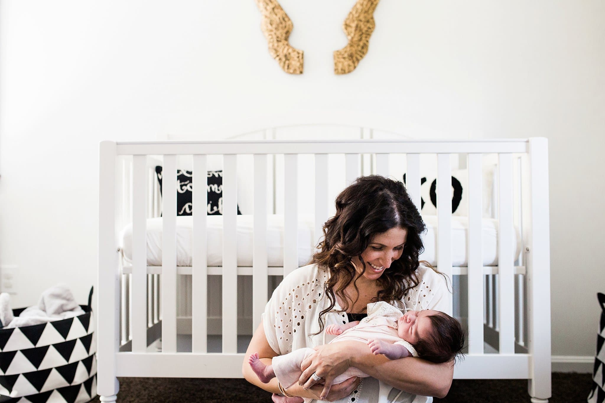 lifestyle family photos in beautiful nursery