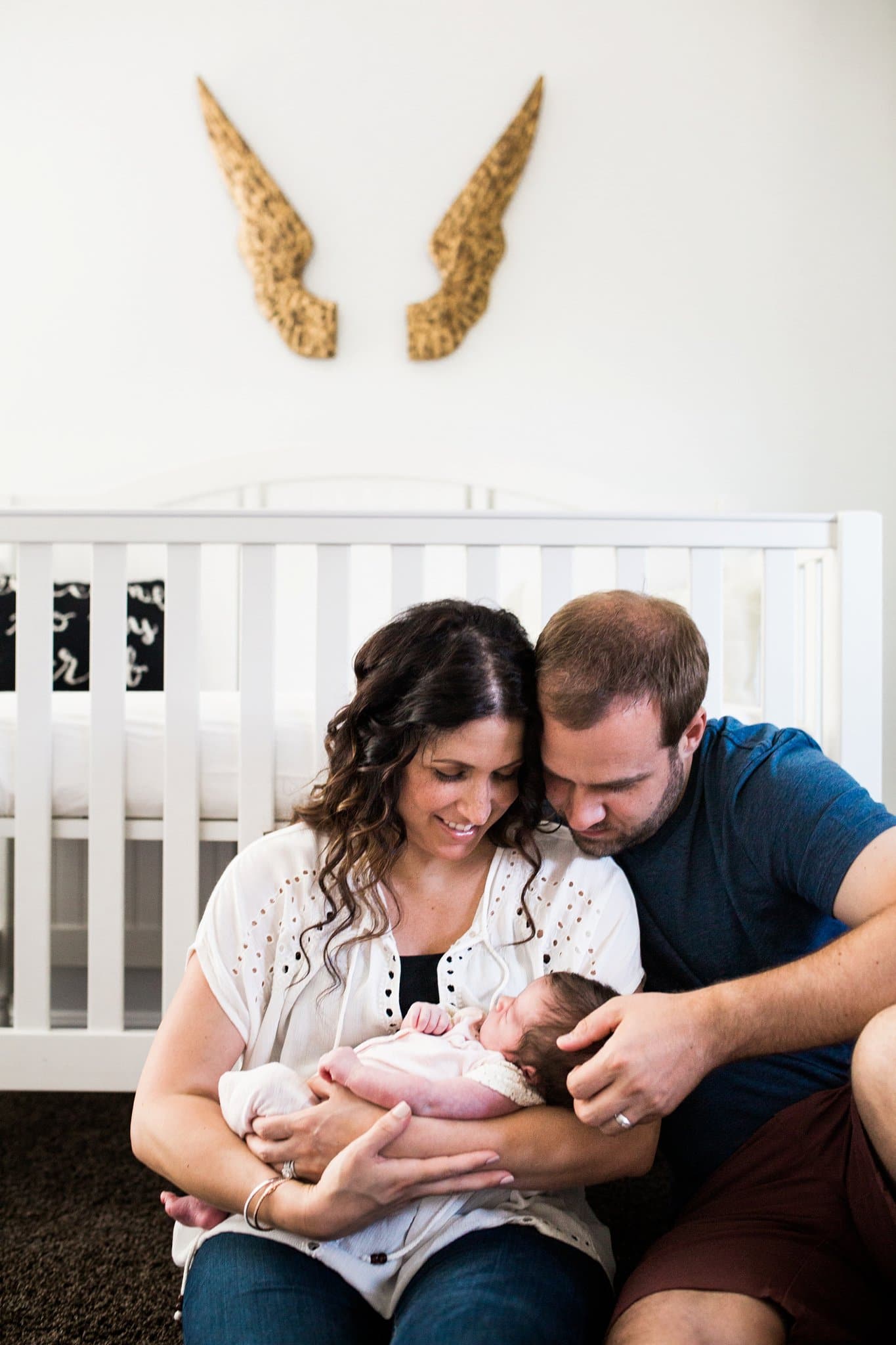 lifestyle family newborn photos in beautiful nursery