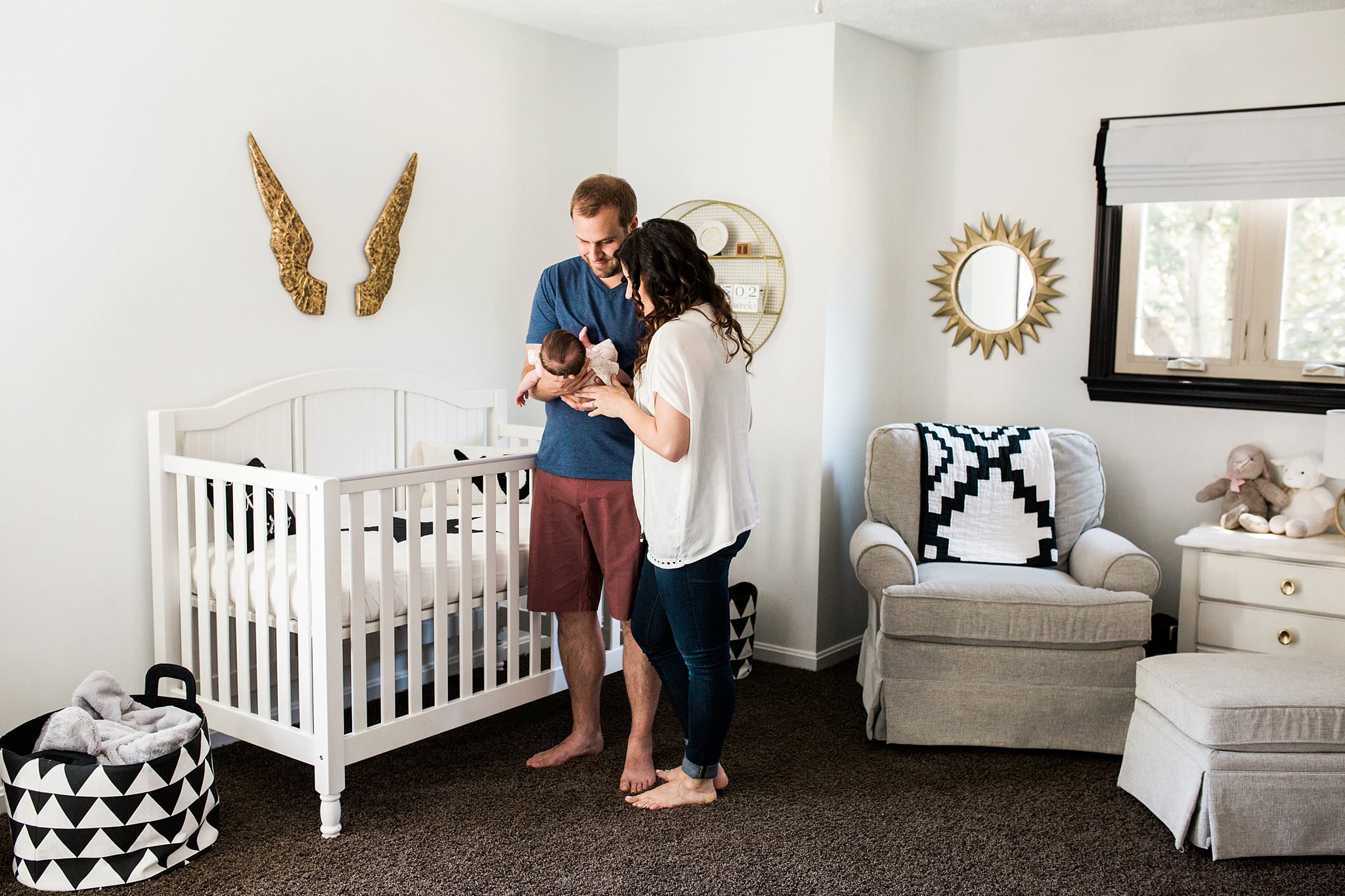 lifestyle family newborn photos in beautiful nursery