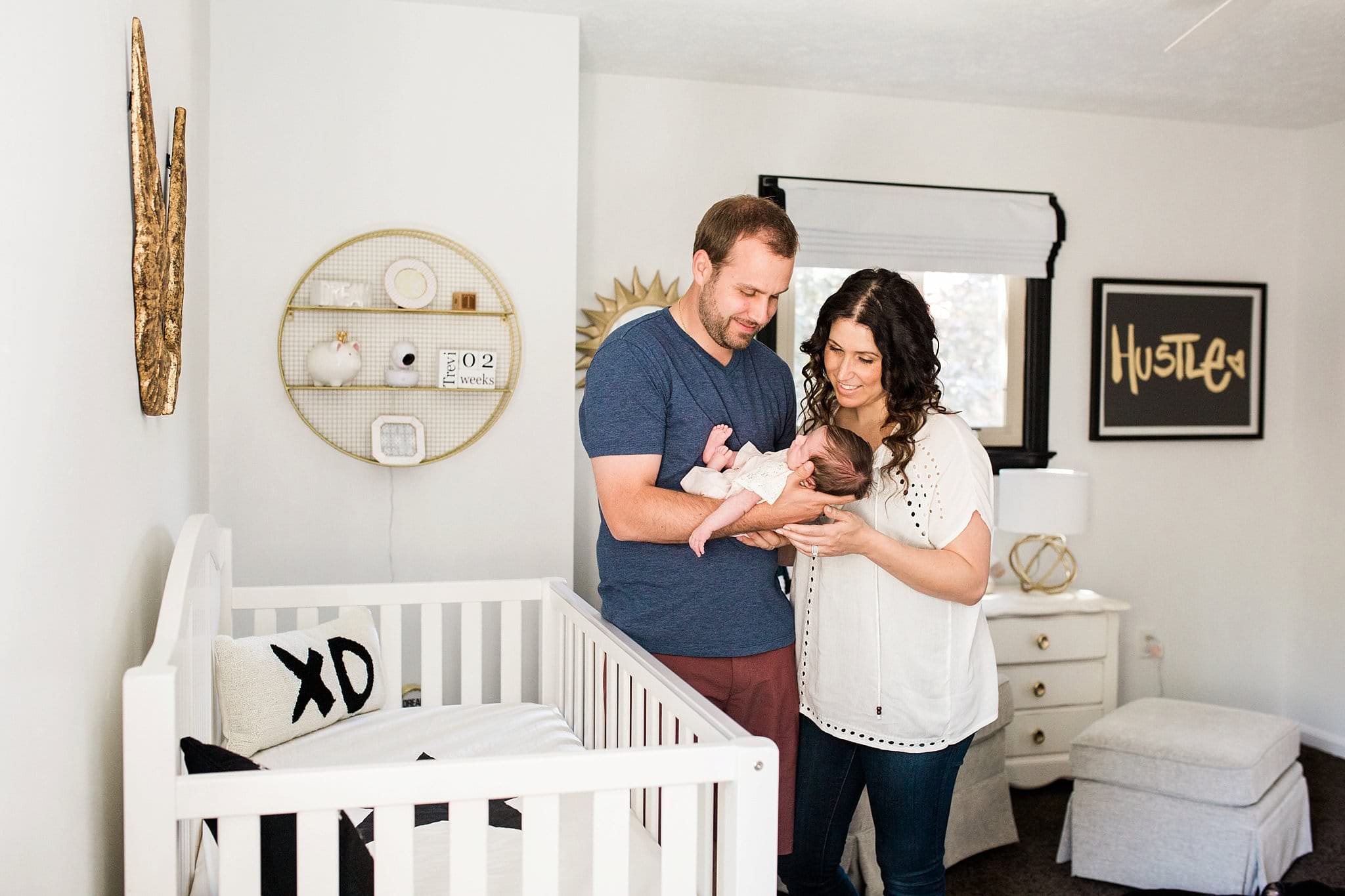 lifestyle family newborn photos in beautiful nursery