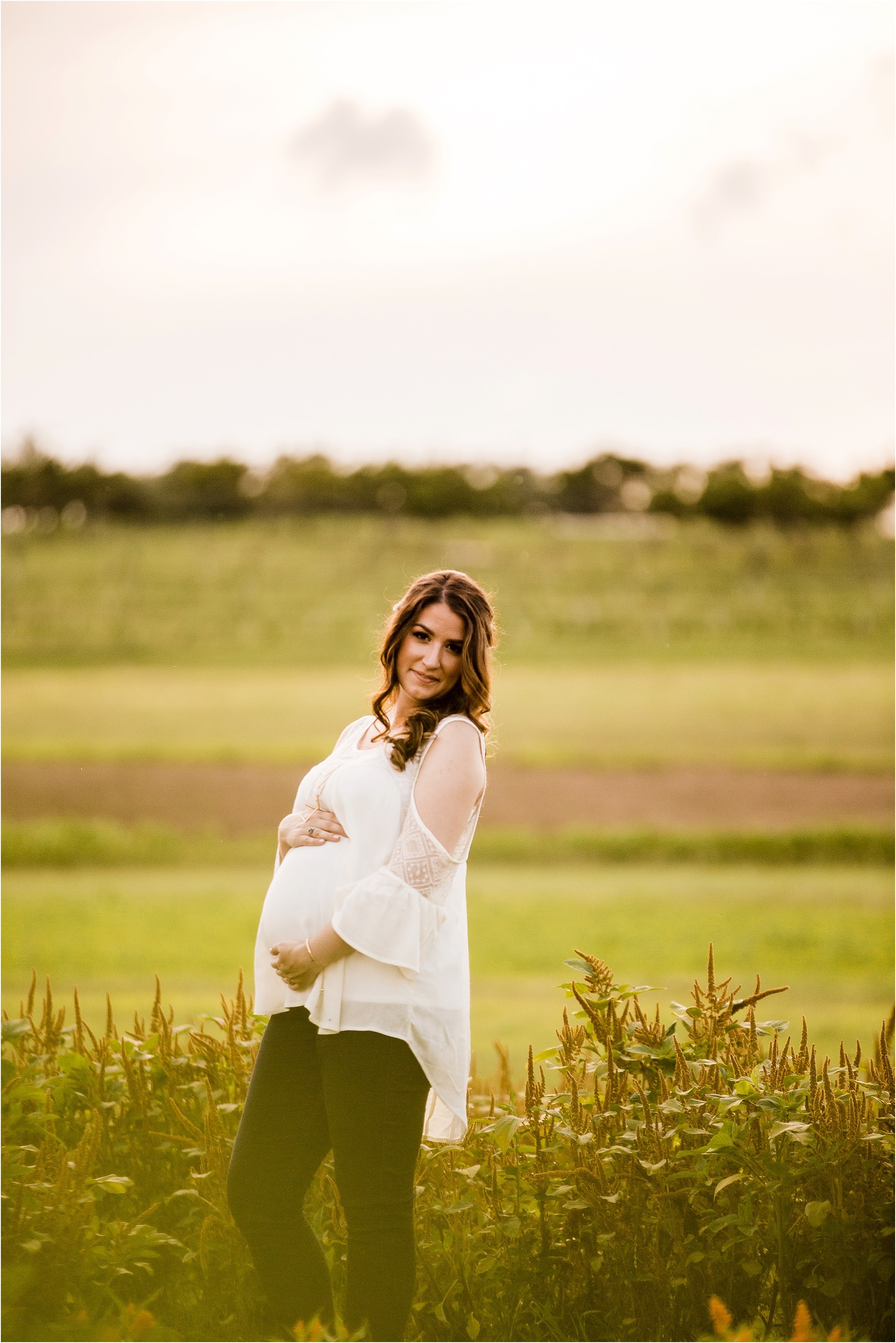 Maternity photos in flower field at Simmons Farm