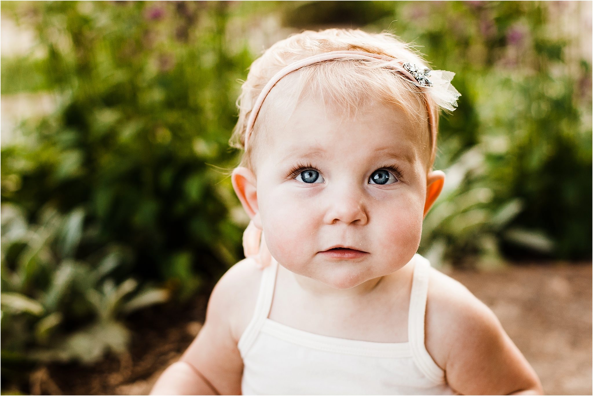 photo of one year old baby girl with big blue eyes