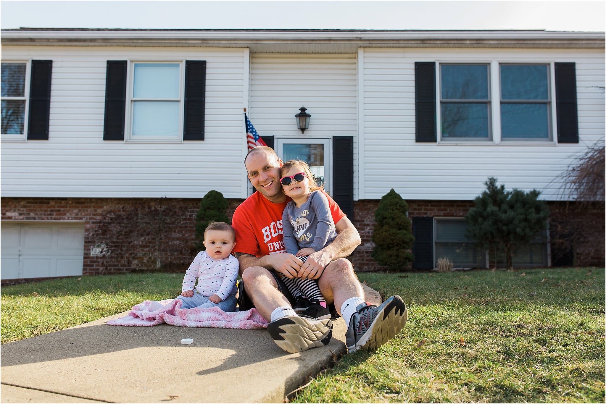 Daddy and daughters in front of home in Pittsburgh PA