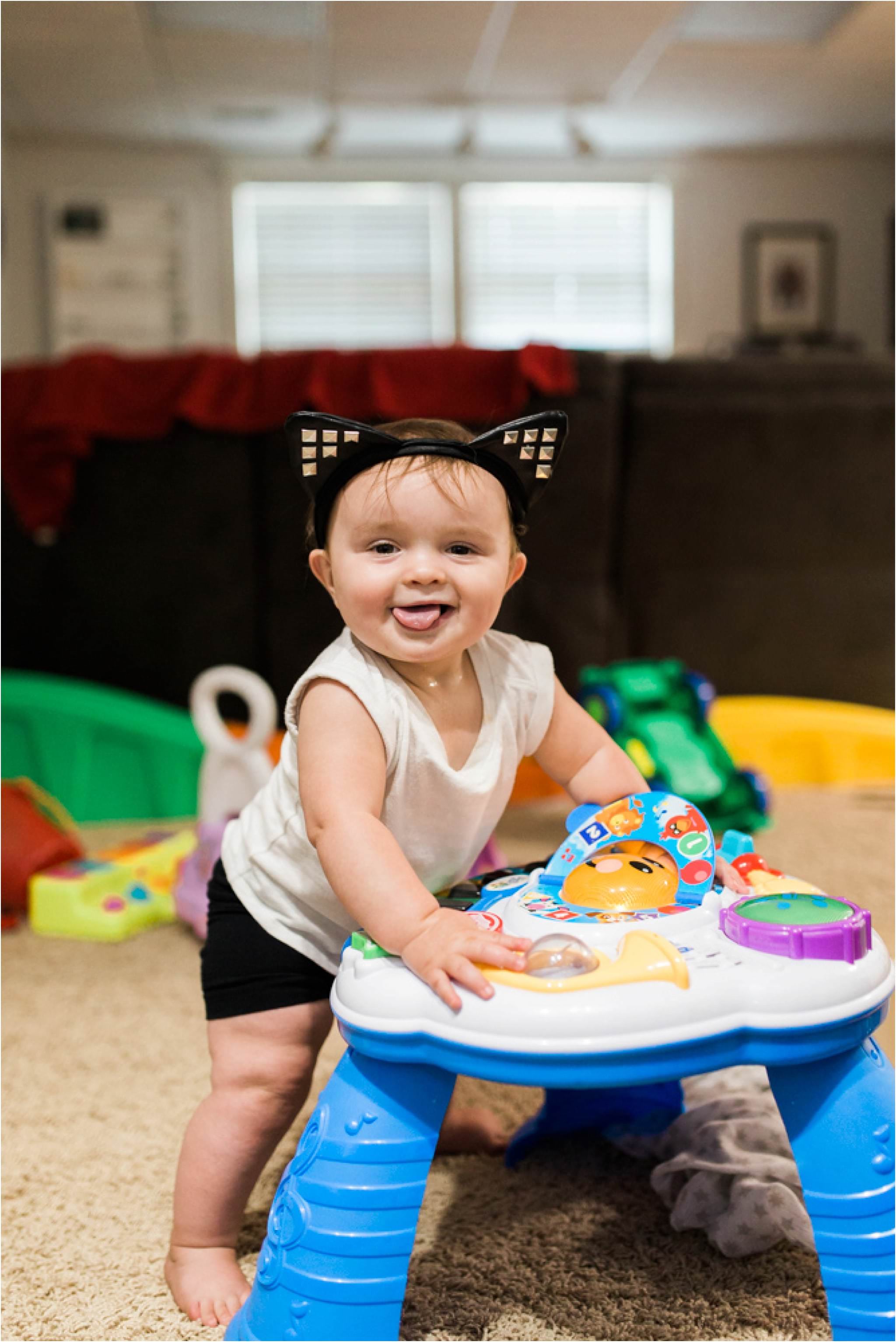 11 month old standing and playing