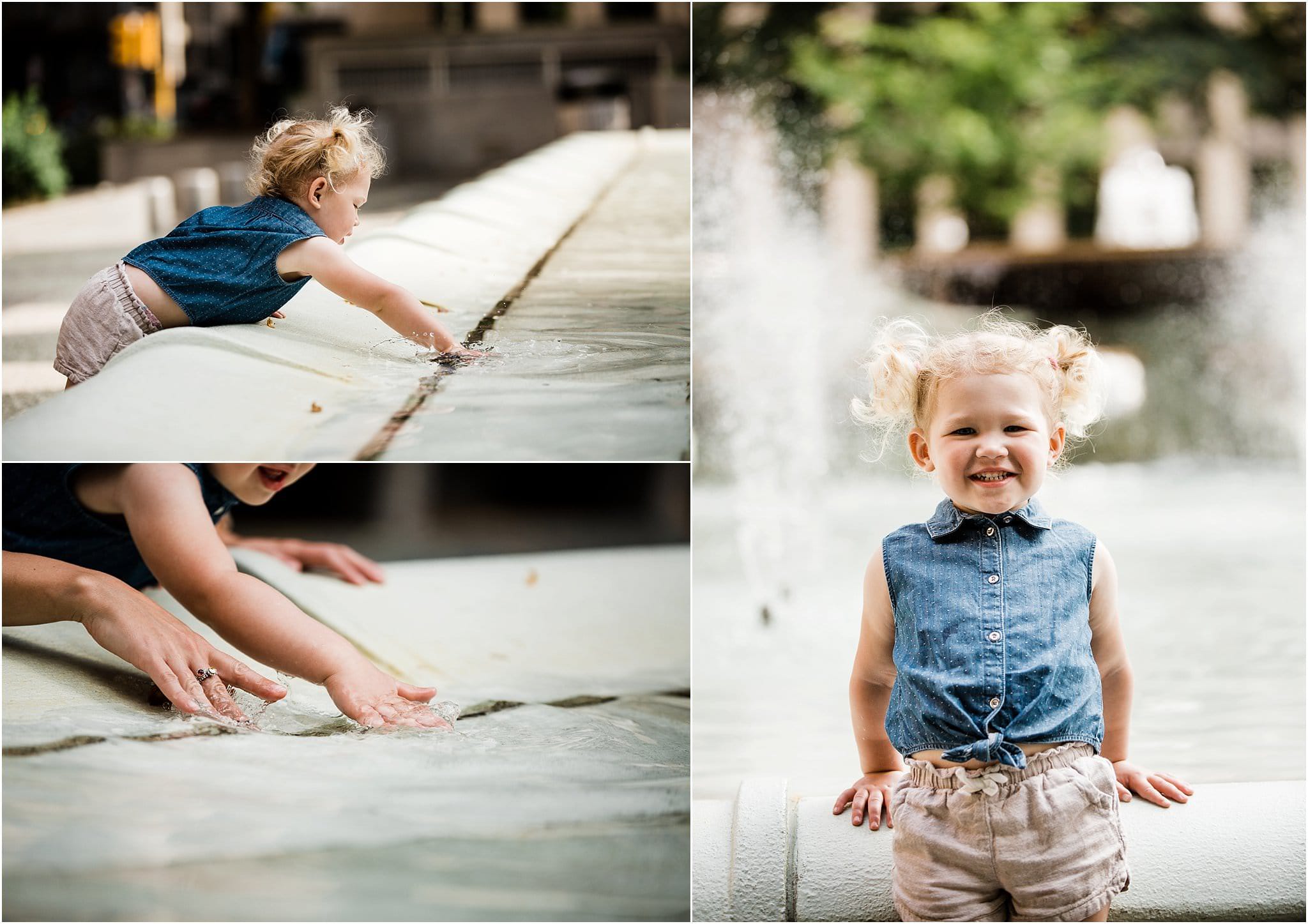 child playing in water fountain