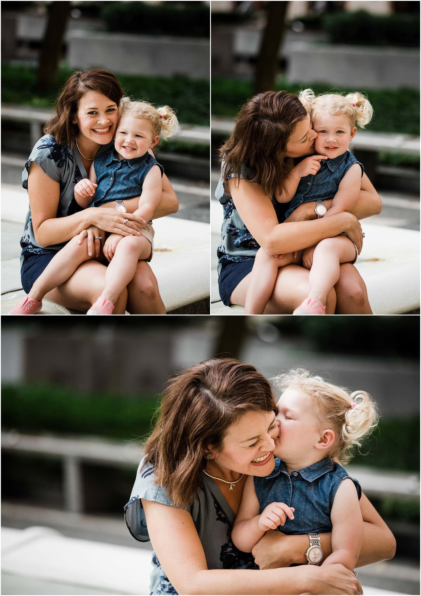 photo of toddler snuggling with mother downtown 