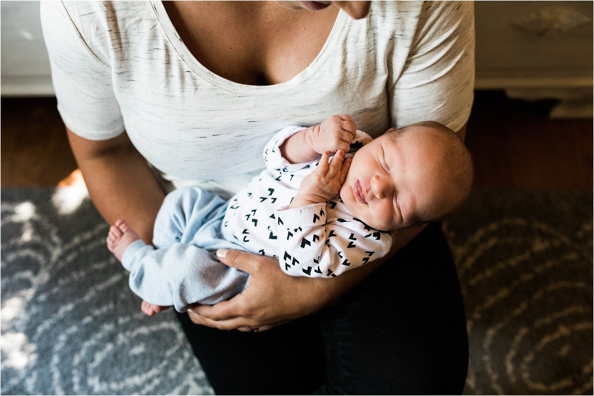 mother holding newborn baby boy