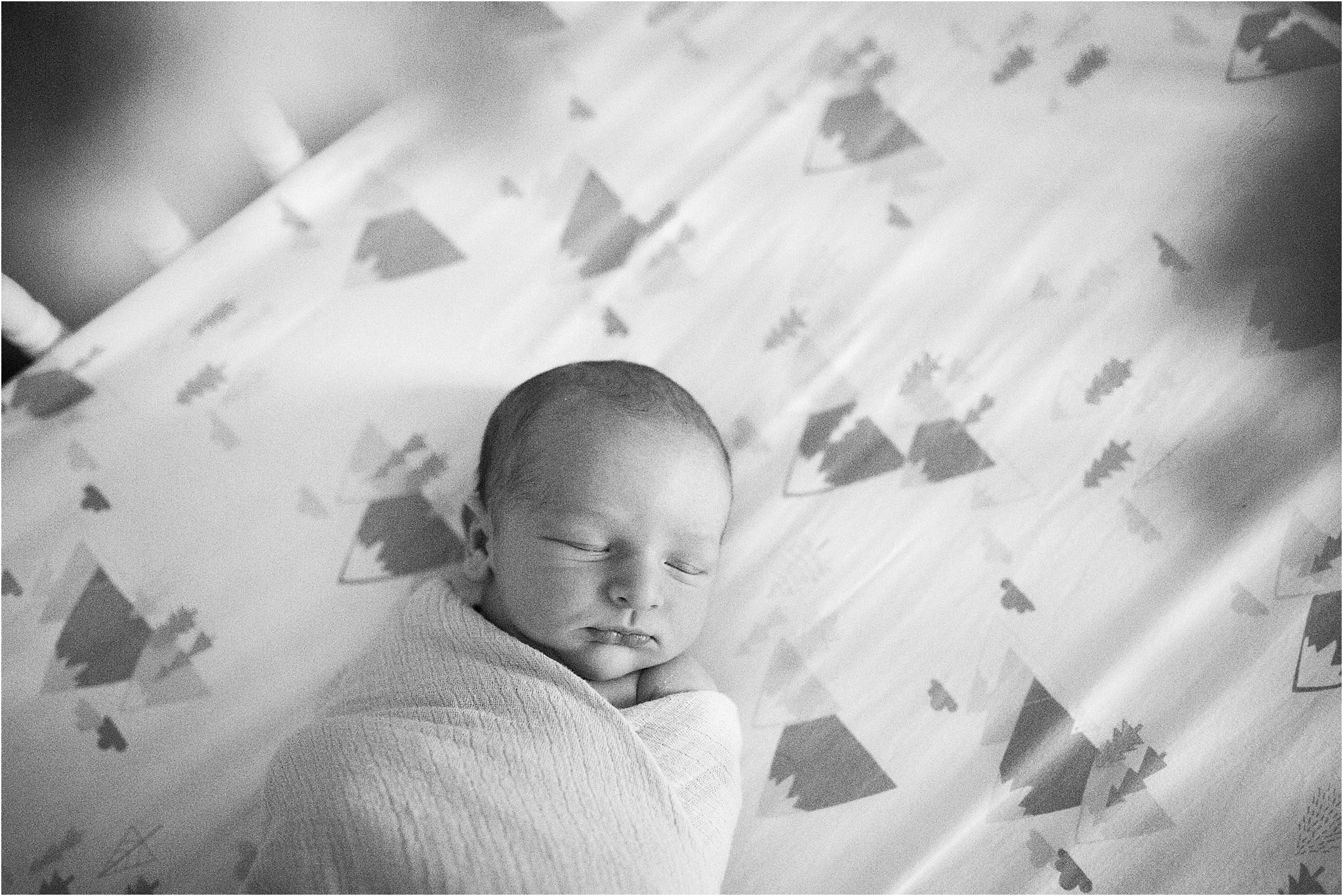 newborn sleeping in crib