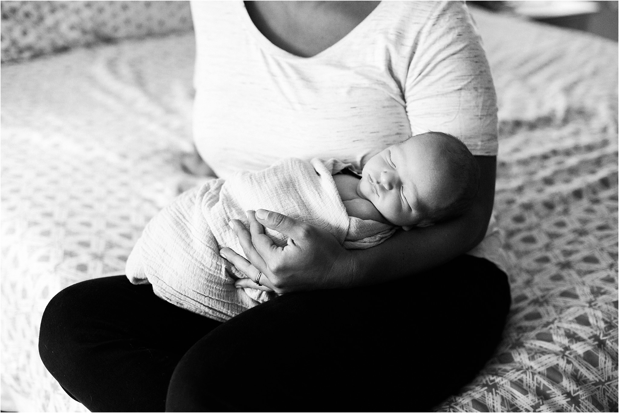 newborn baby boy in the arms of his mother