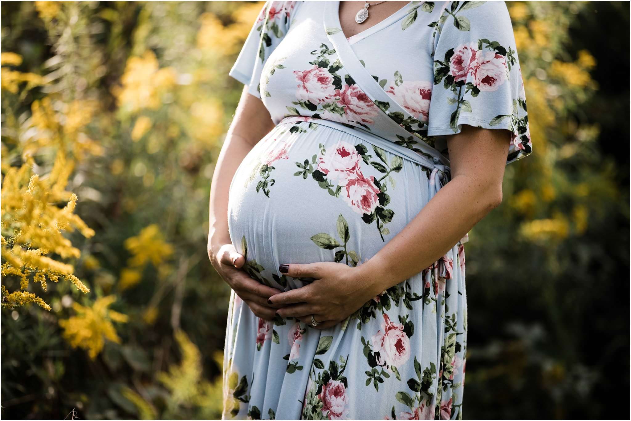 baby bump photo in floral maternity dress