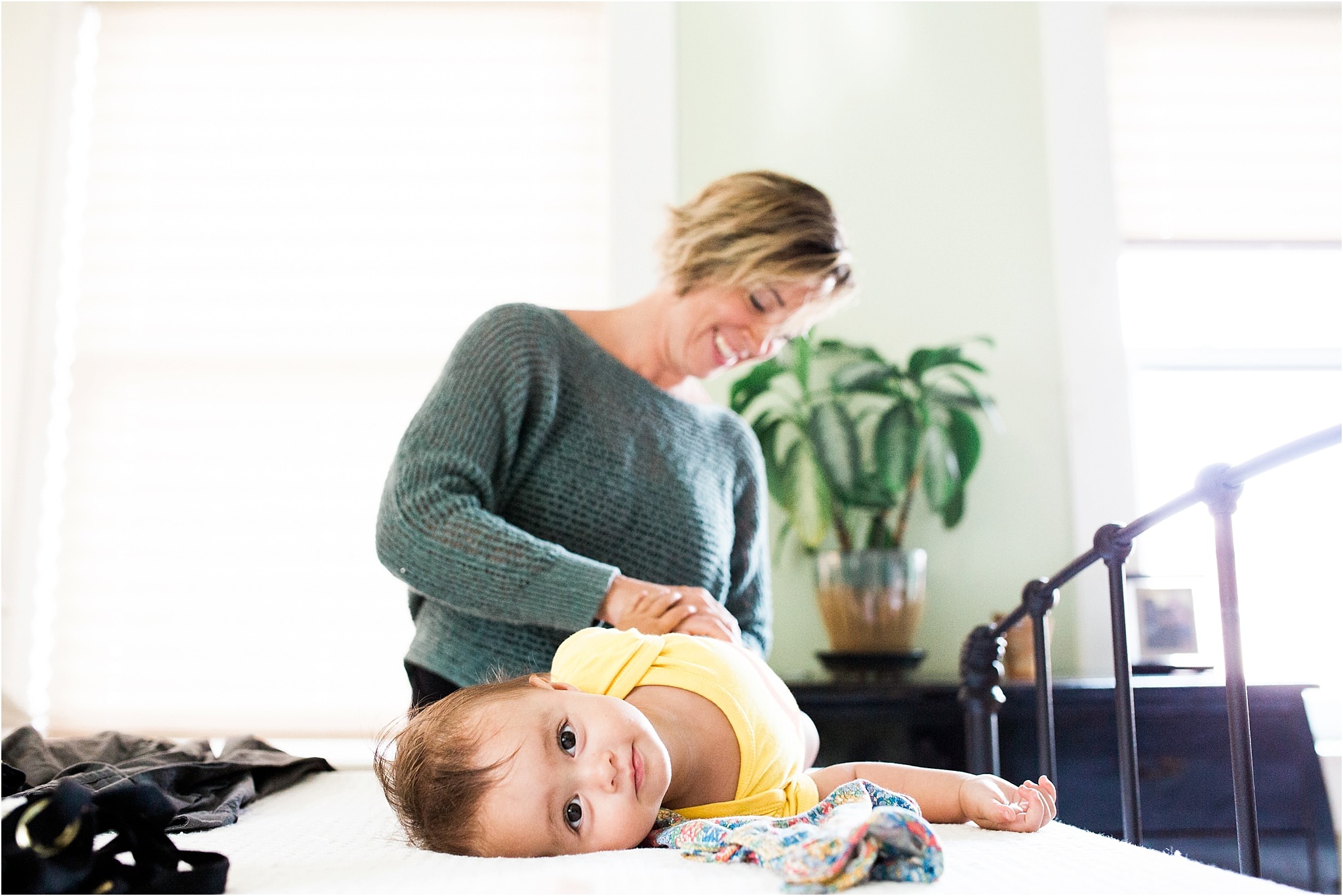 Mother changing baby