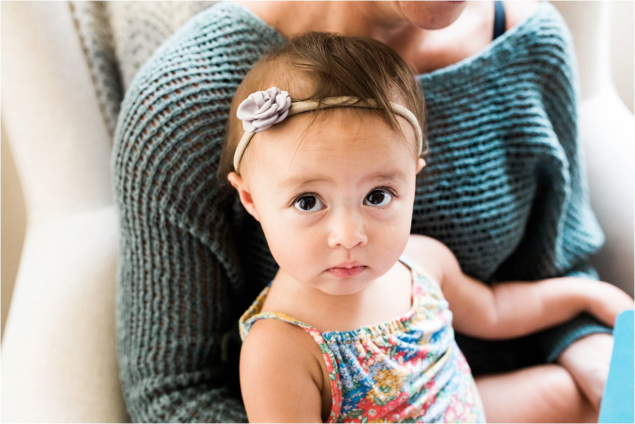 baby girl in mothers arms