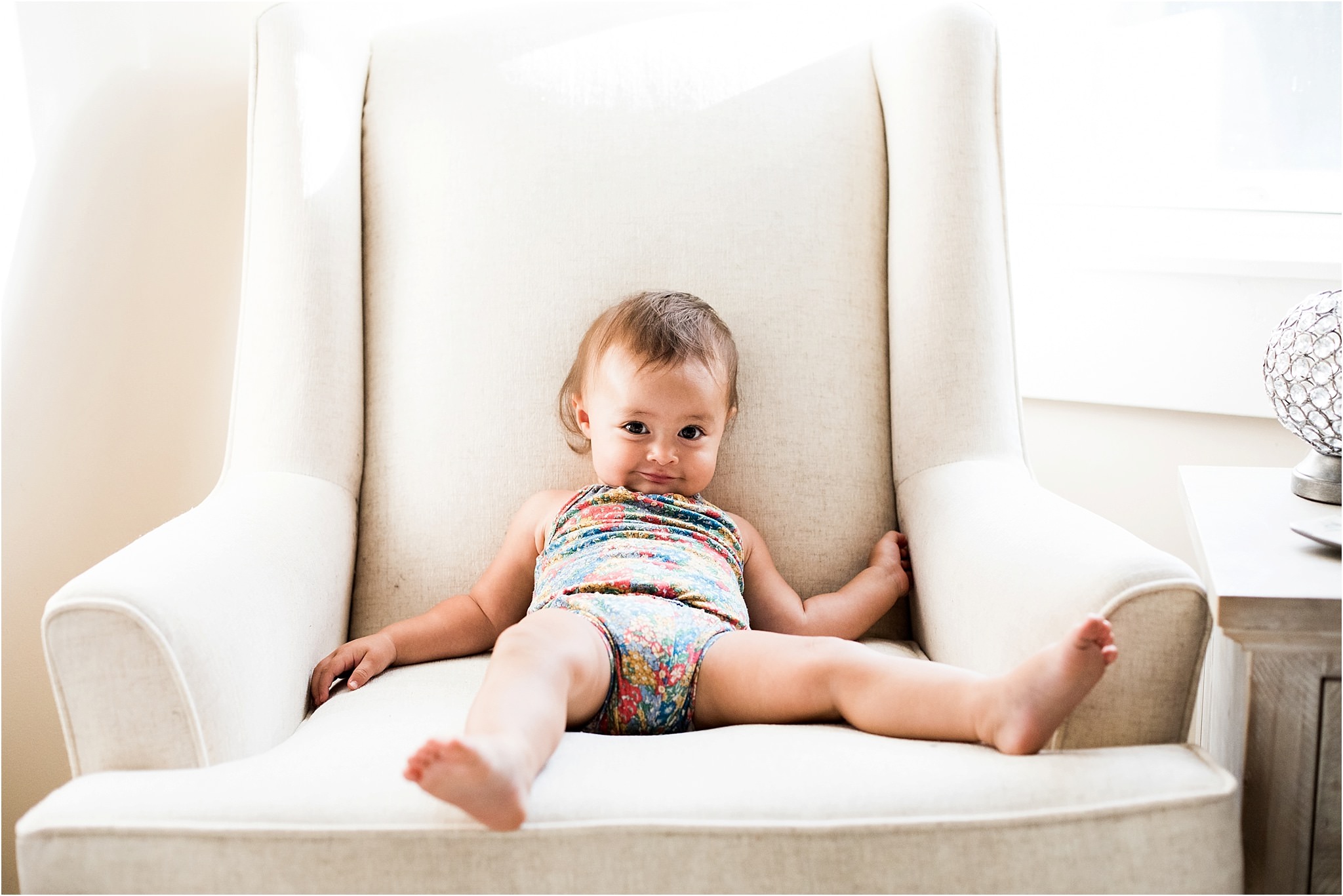 baby girl slouching in nursery chair