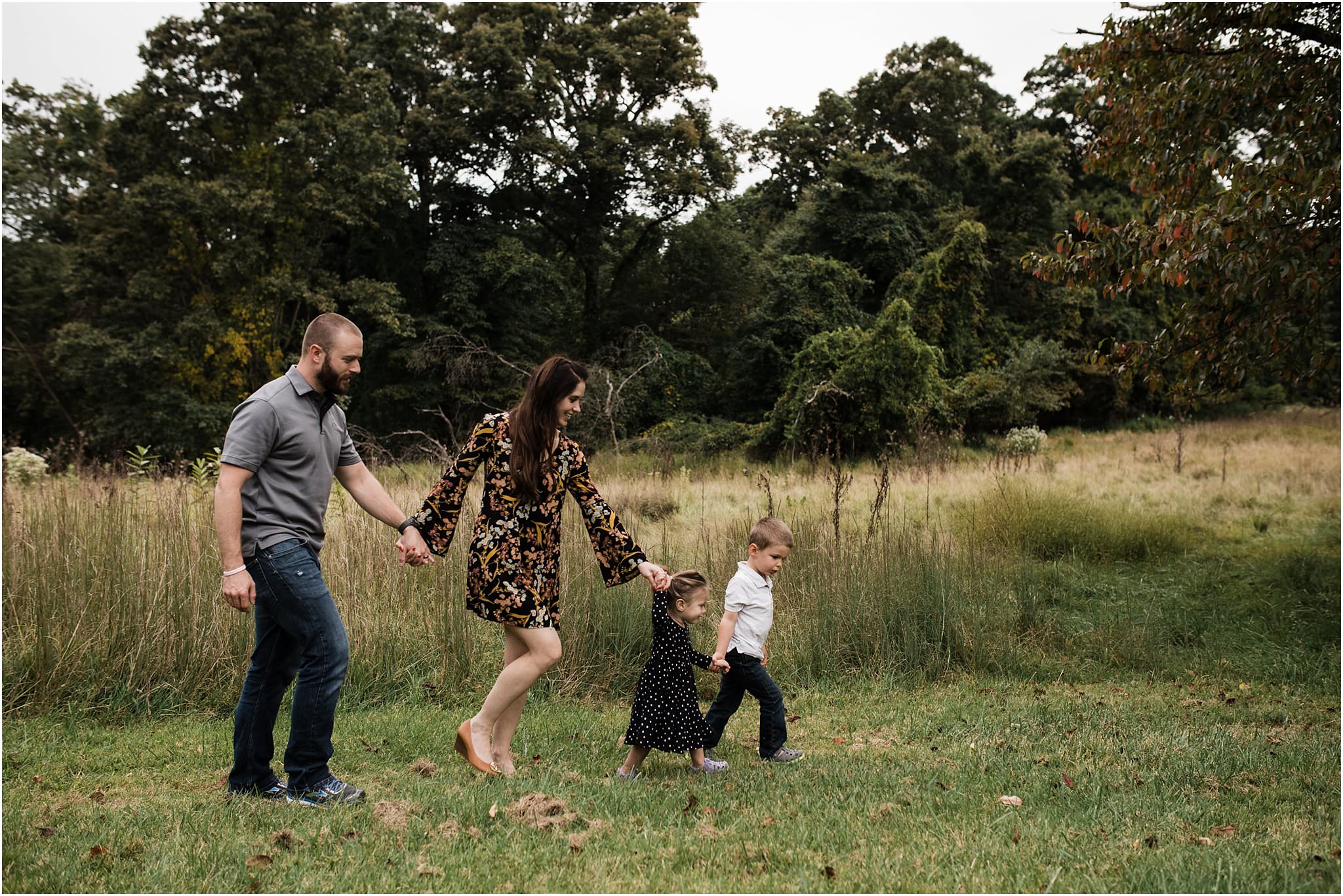 family walking in fields at North Park