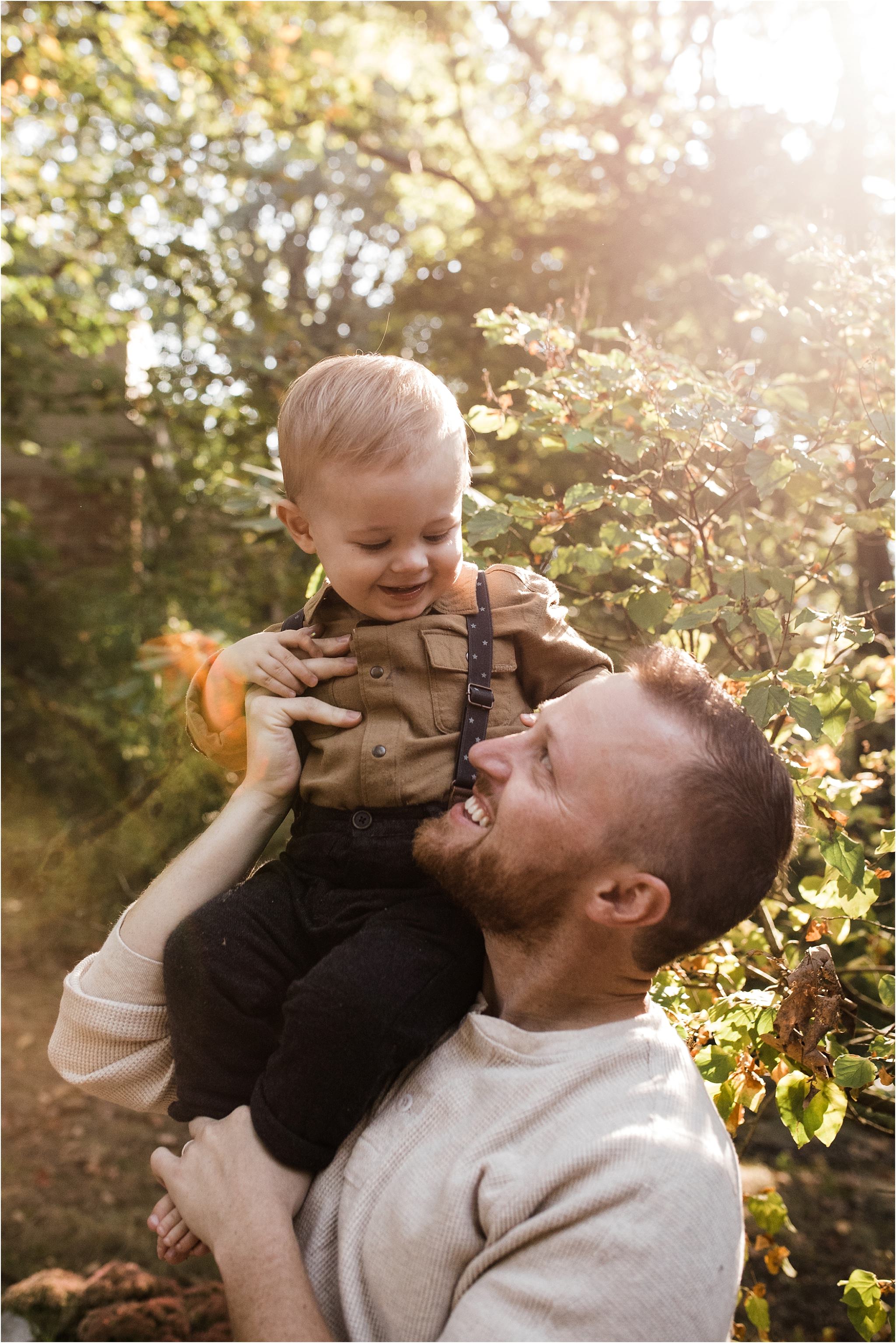 Toddler boy on fathers shoulders