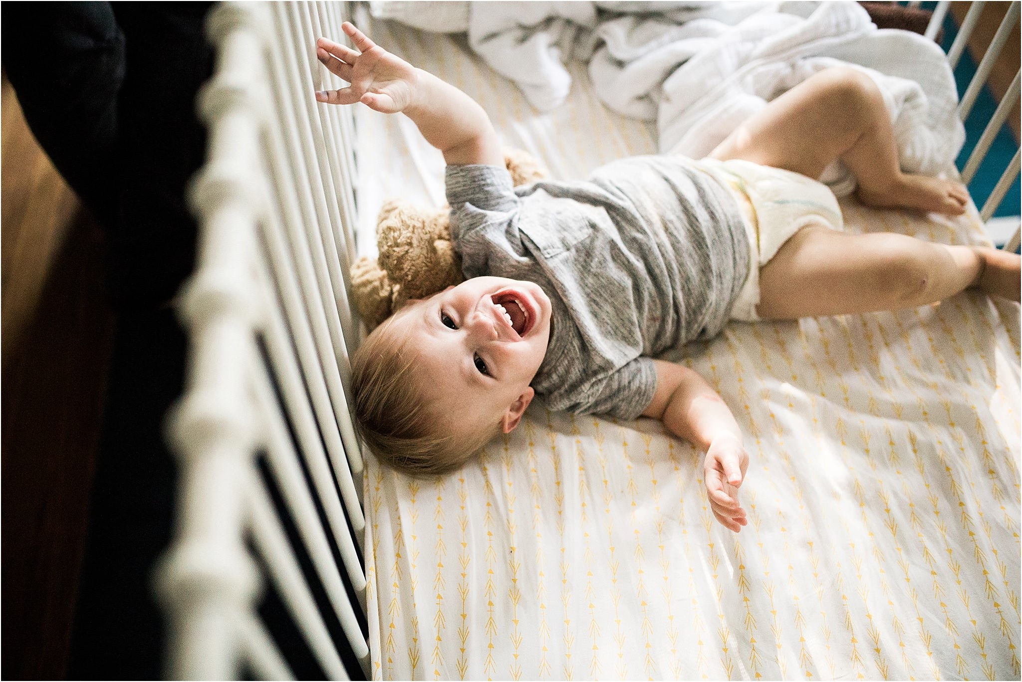 one year old boy in crib