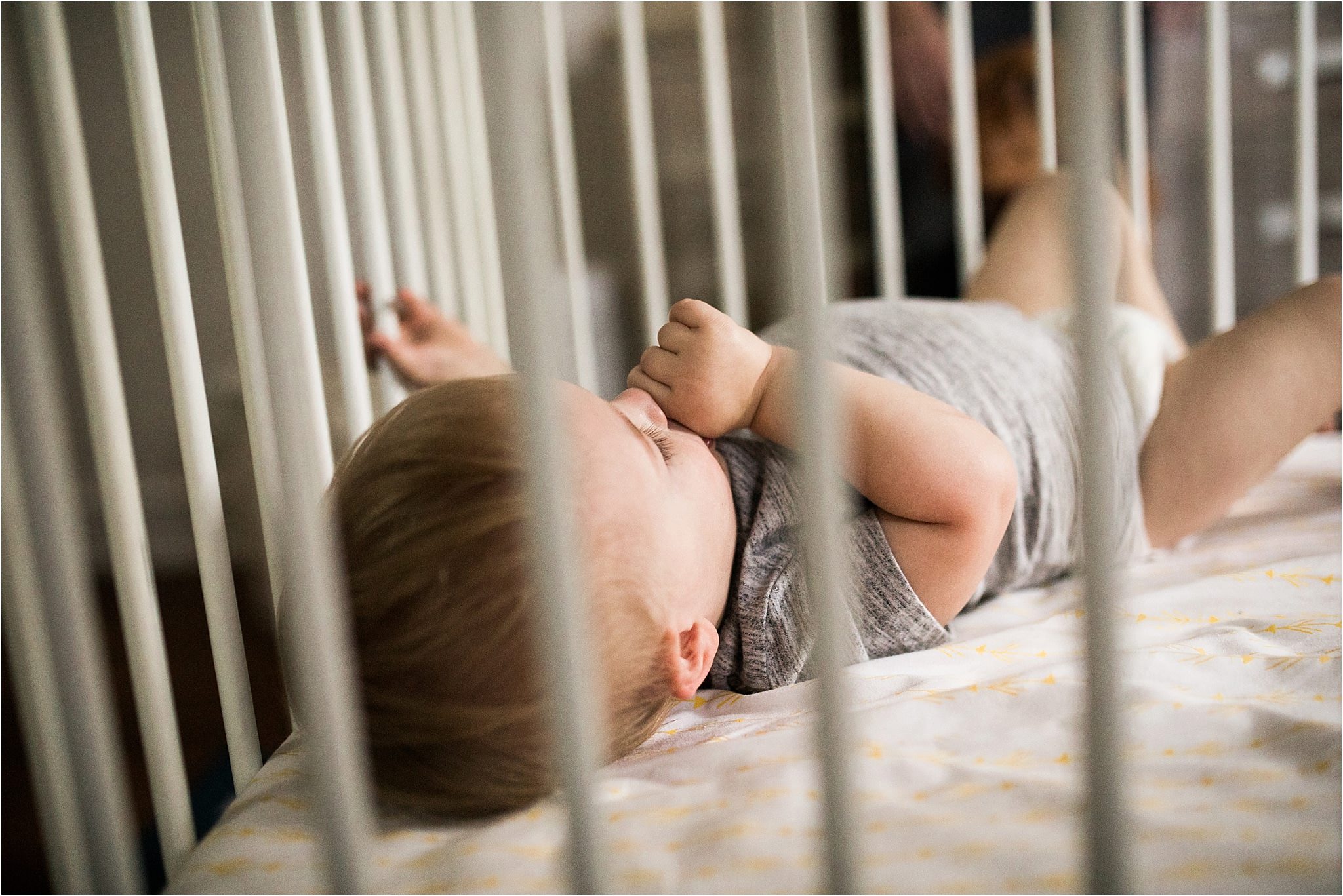 toddler sucking thumb in crib