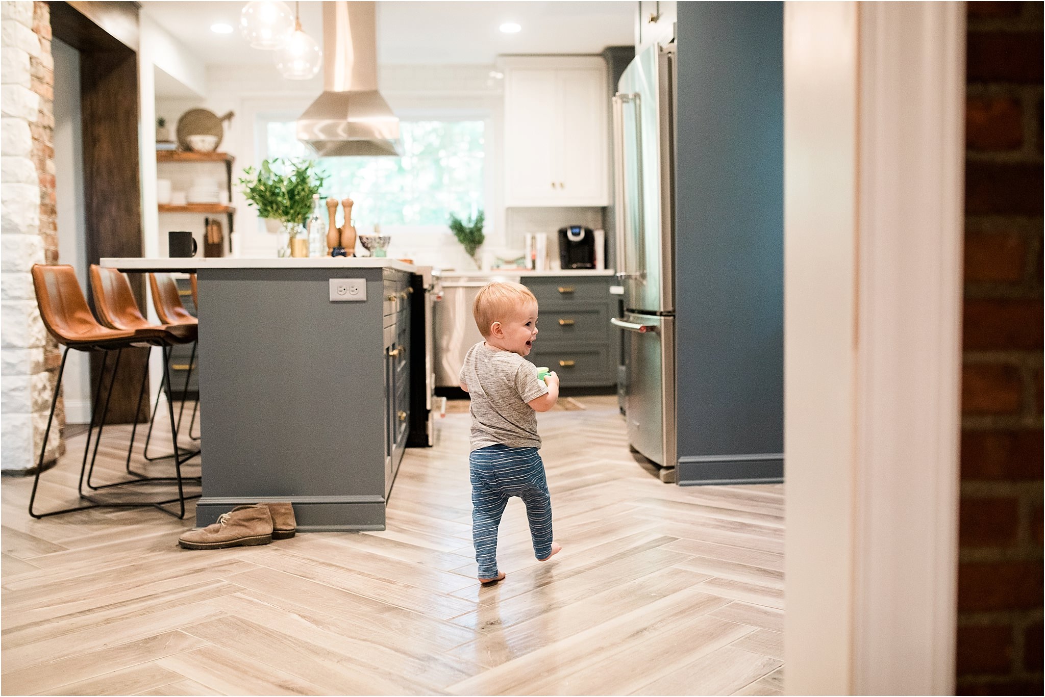 toddler walking through family kitchen