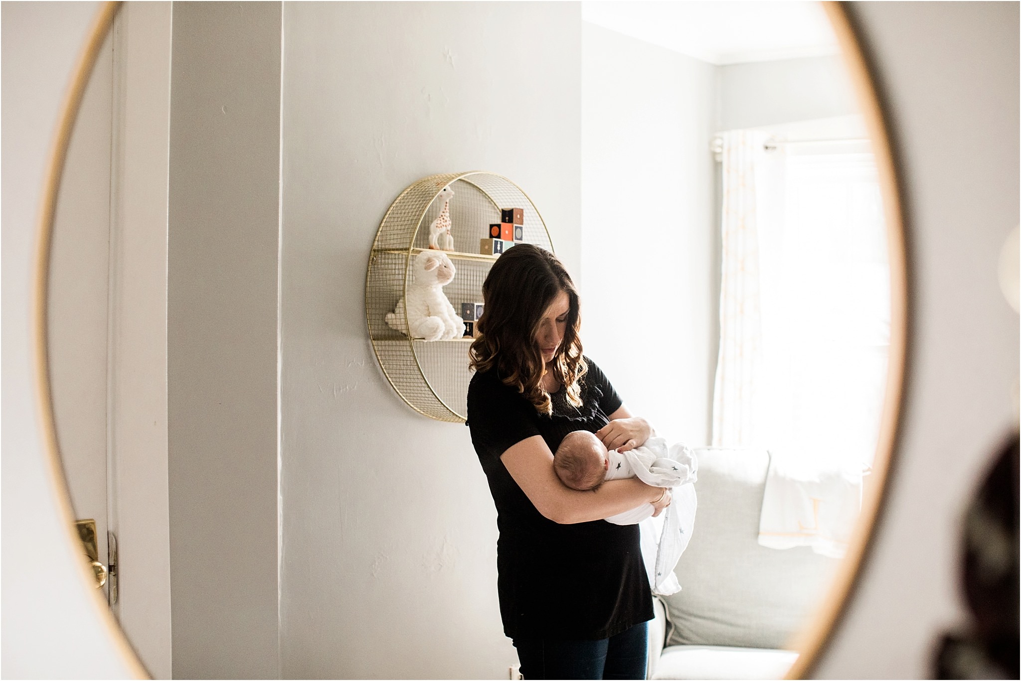 photo of mother soothing newborn baby