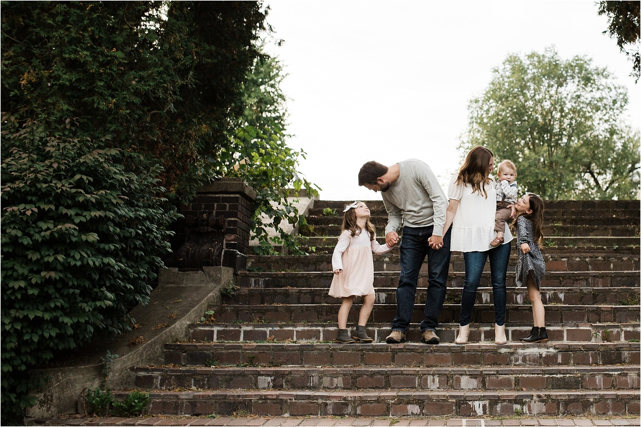 photo of family standing on staircase