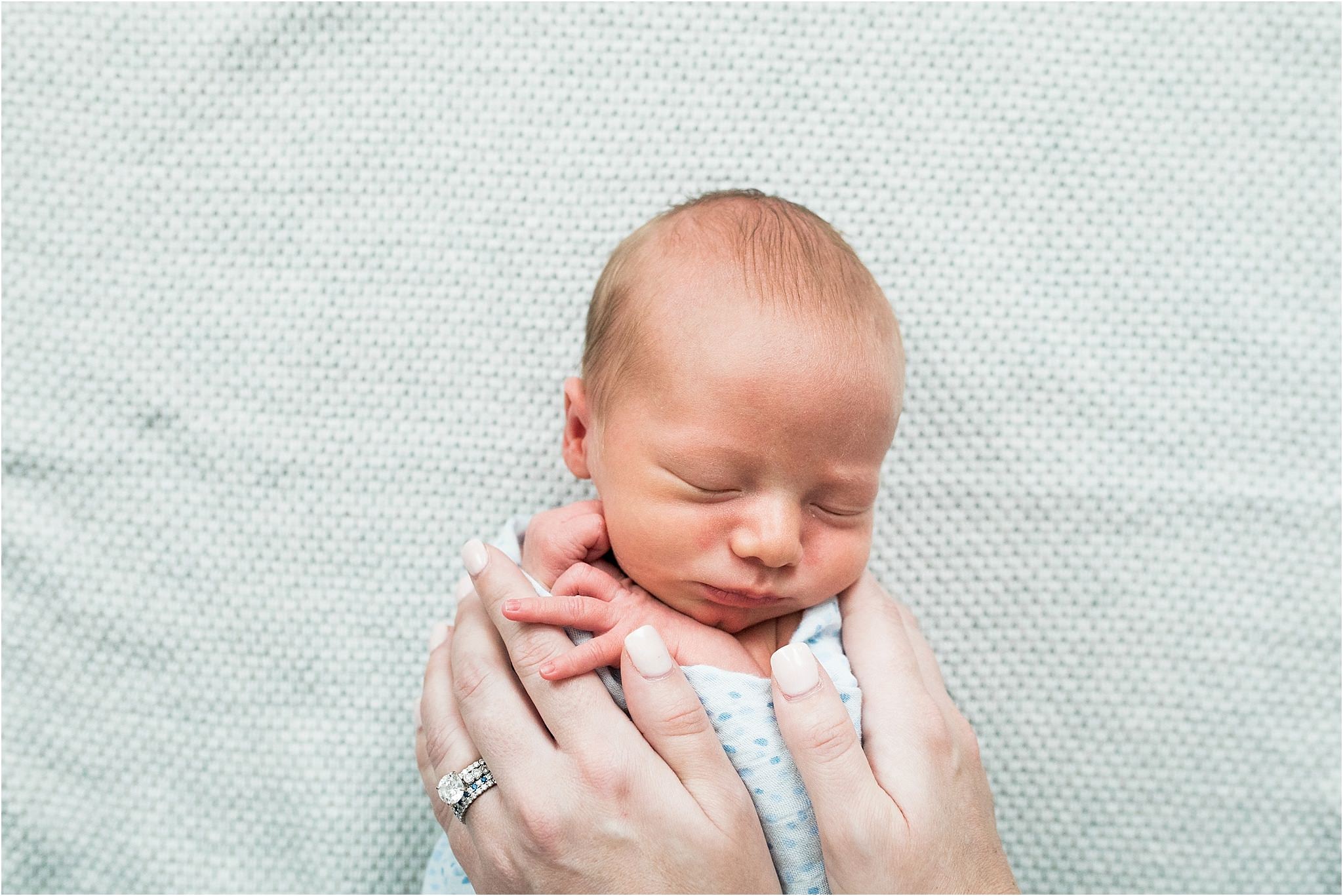 mamas hands on sleeping baby 