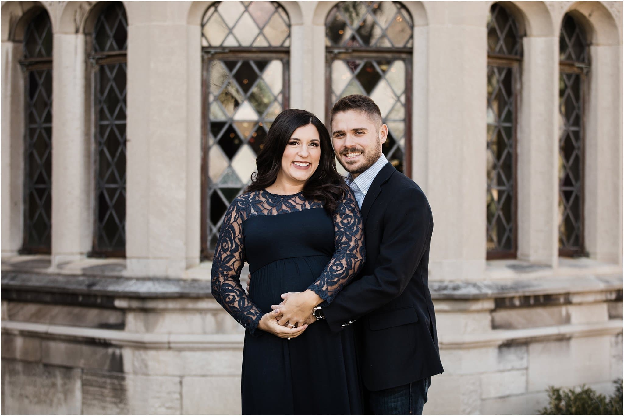 beautiful expecting mother in blue lace maternity dress with husband