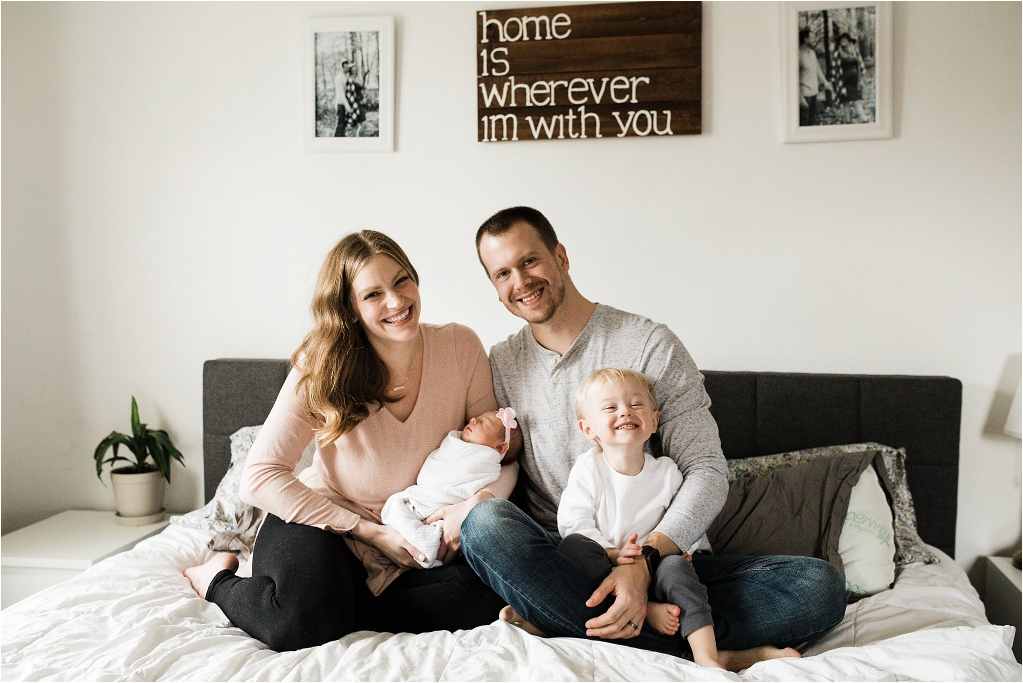 family photos in bedroom at newborn session at home