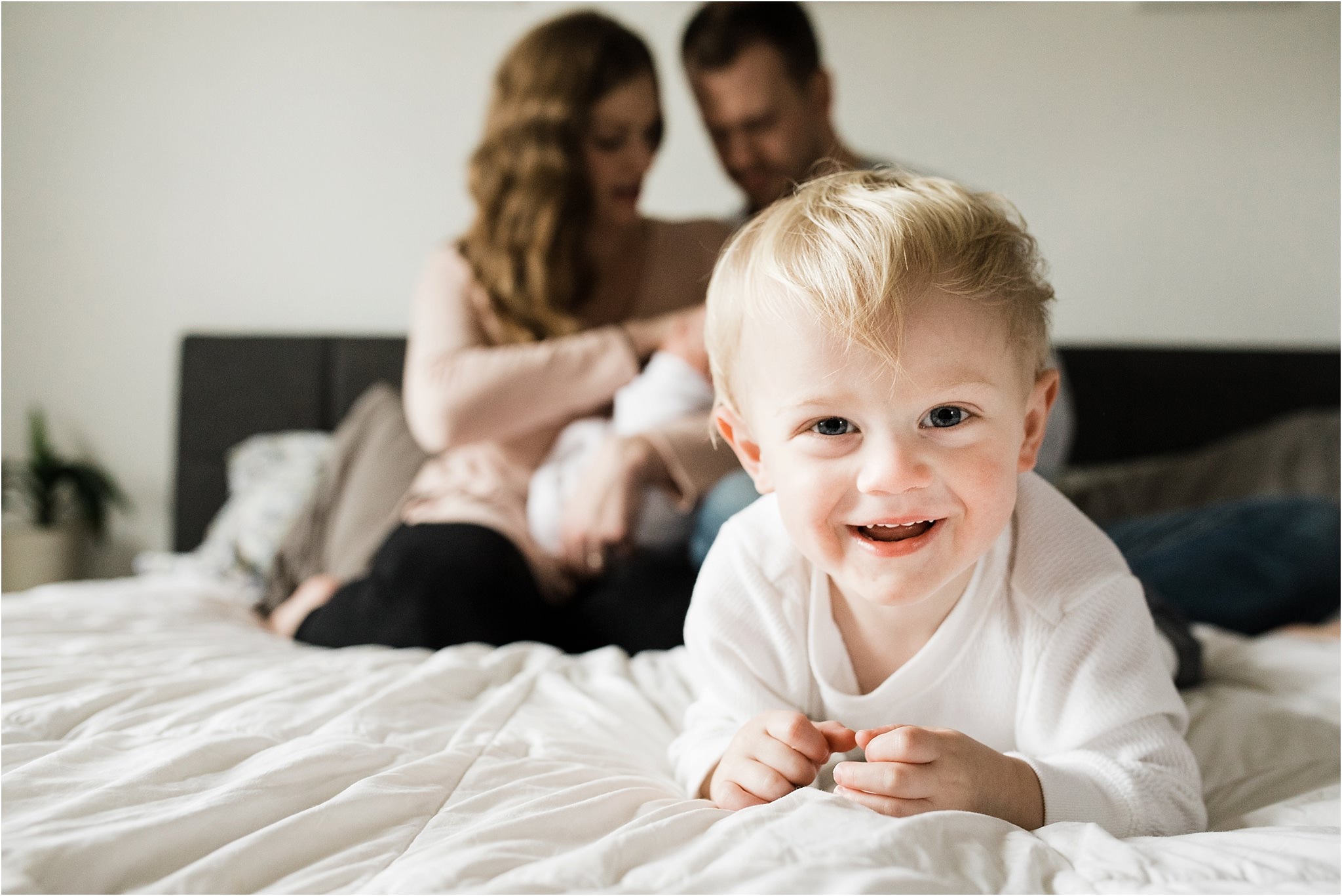 family photos in bedroom at newborn session at home