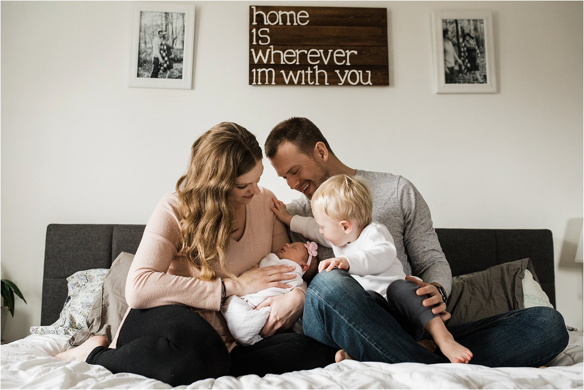 family photos in bedroom at newborn session at home