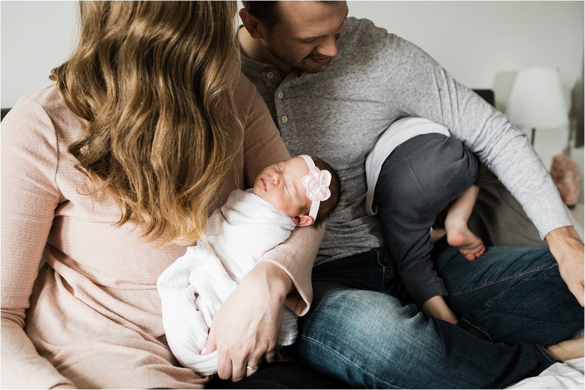 family photos in bedroom at newborn session at home