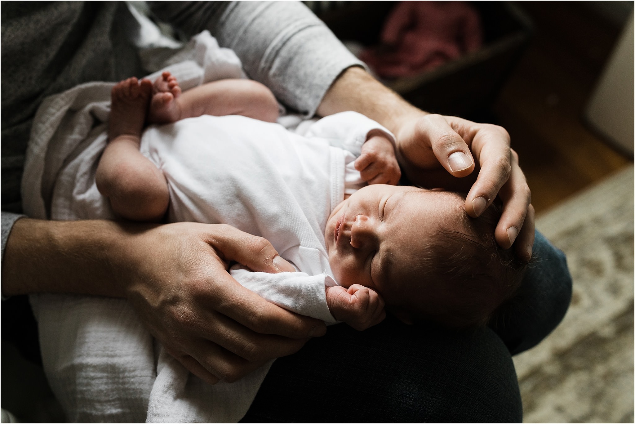 newborn photos at home in parents hands