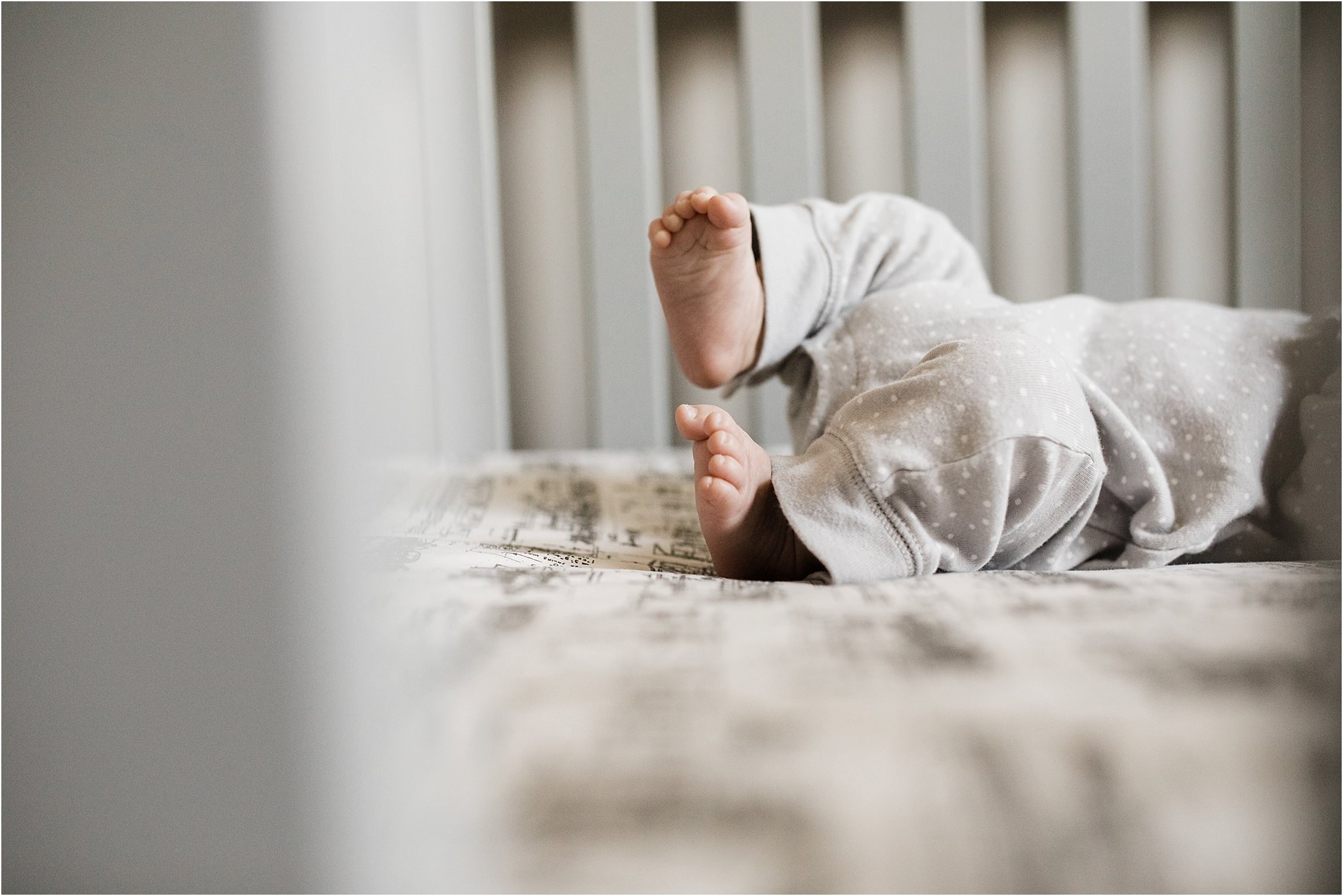 newborn toes peeking through crib