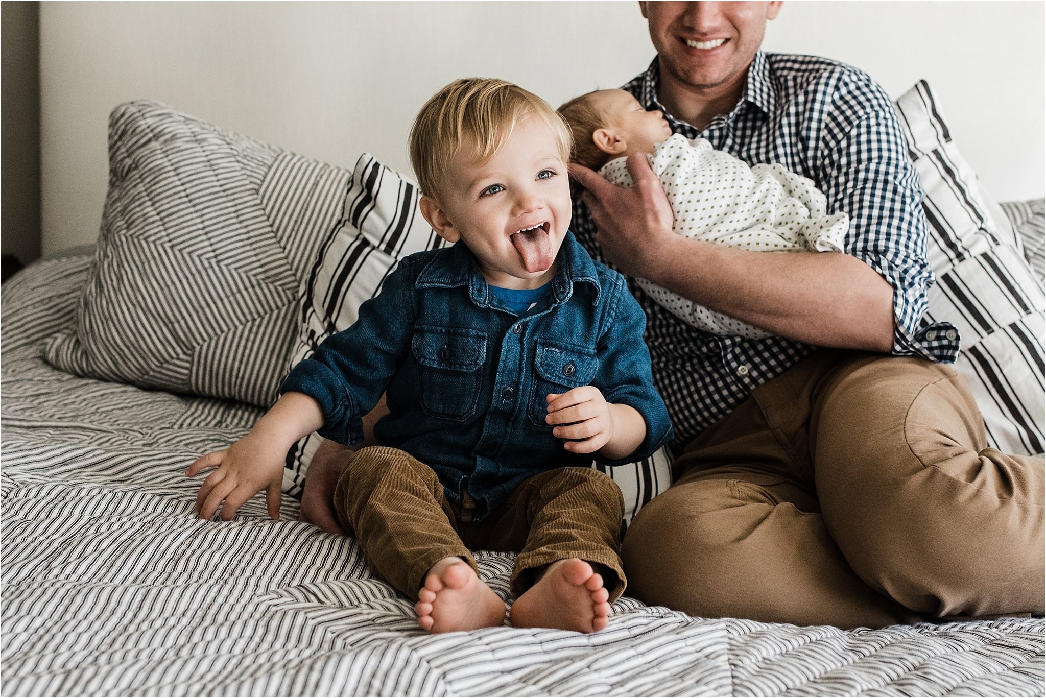 older sibling being silly during home newborn session