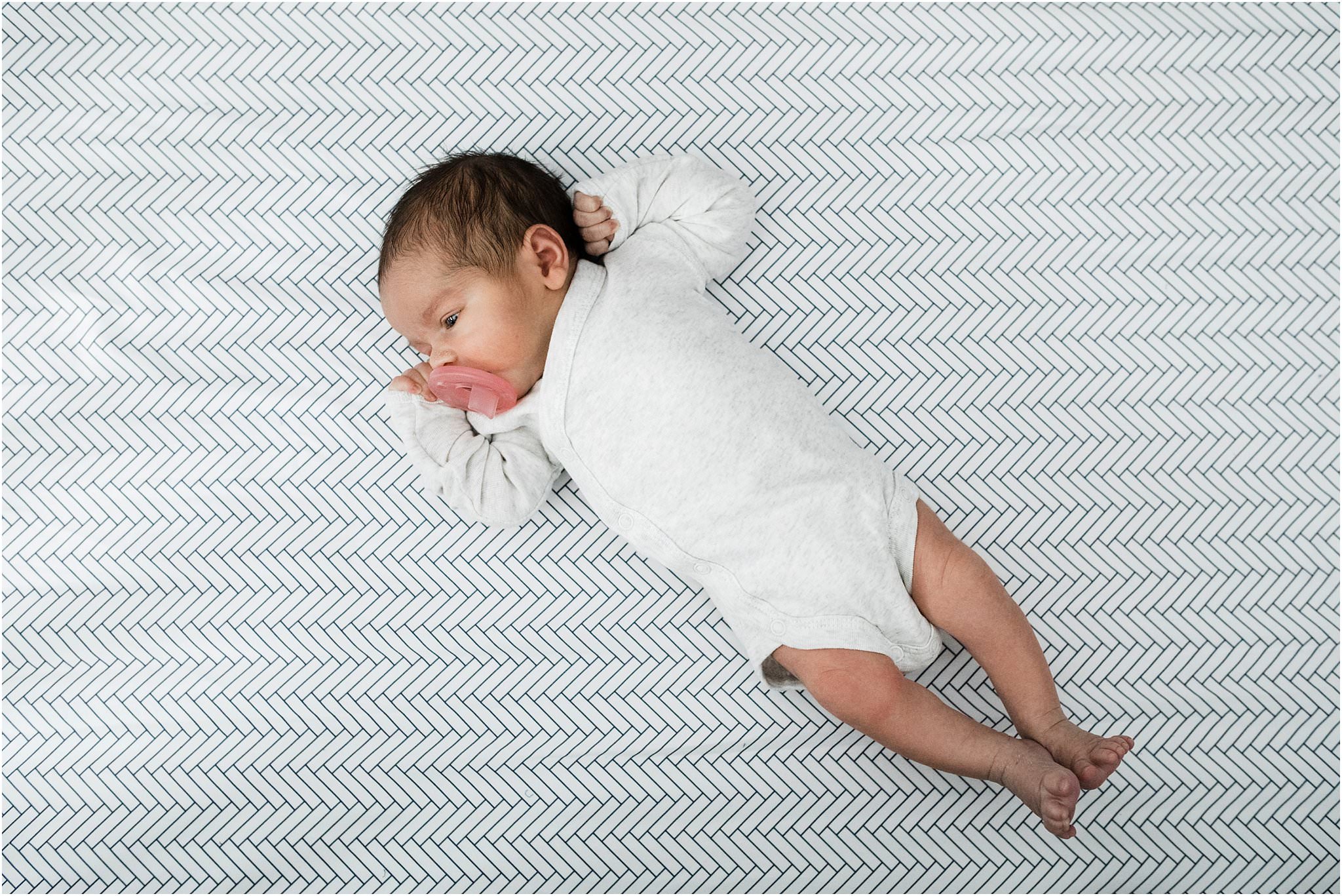 natural in home newborn photo with baby in crib