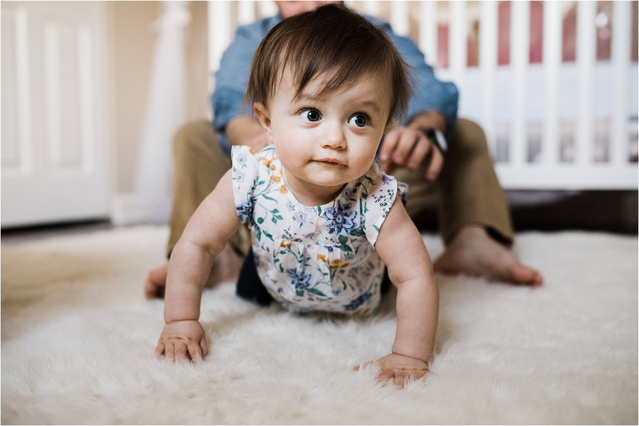 ONE YEAR OLD GIRL CRAWLING IN NURSERY