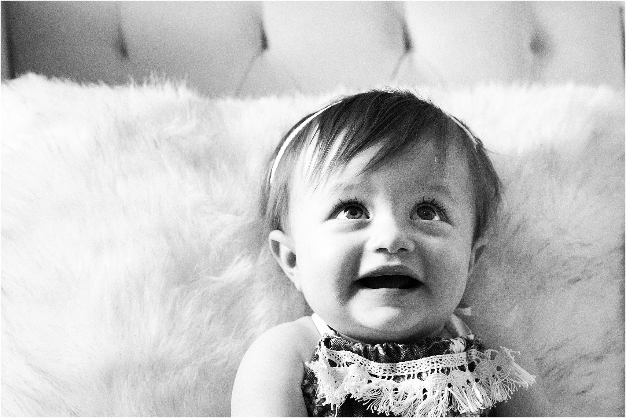 ONE YEAR OLD GIRL IN FLORAL ROMPER PHOTOS IN NURSERY