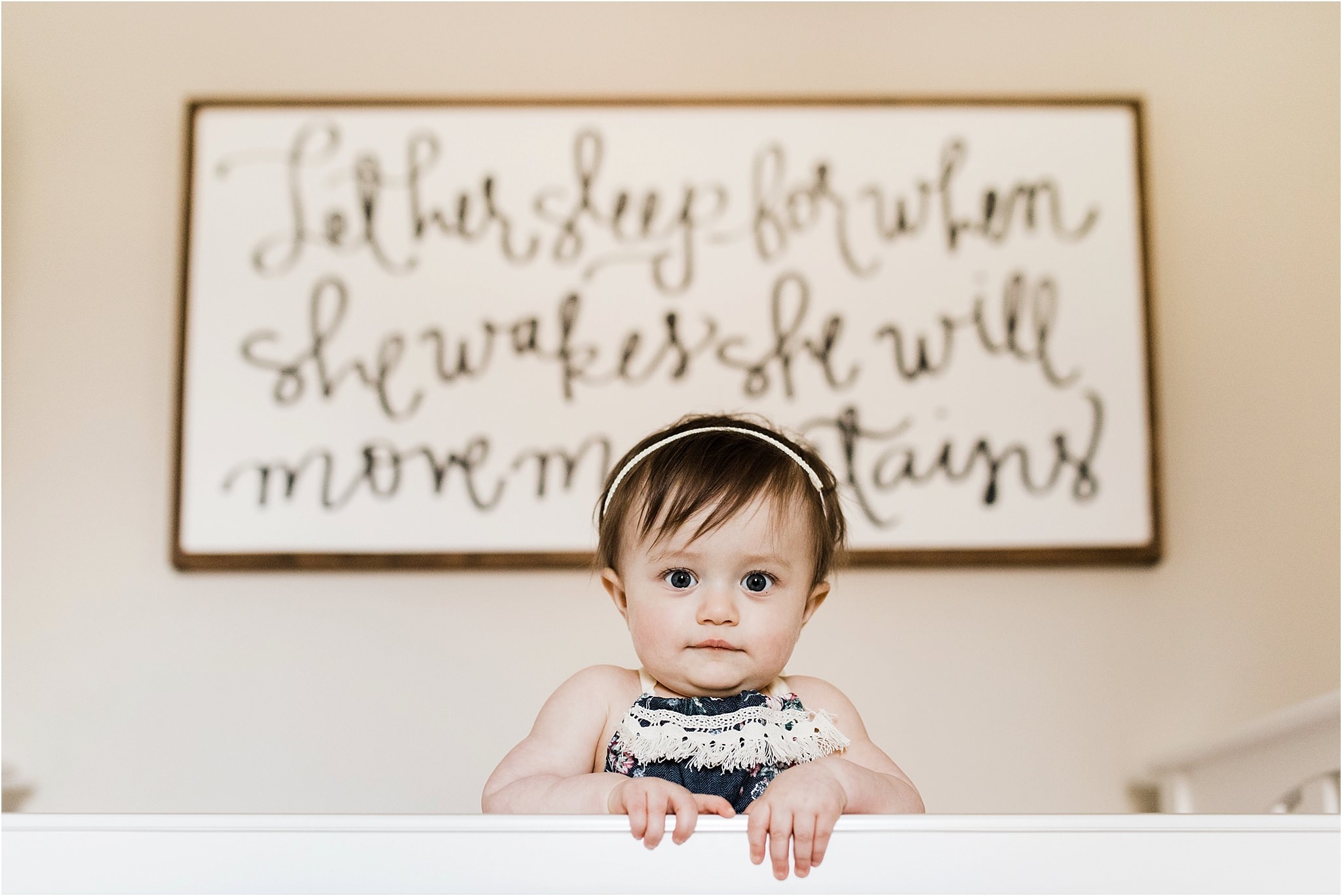 ONE YEAR OLD GIRL IN FLORAL ROMPER PHOTOS IN NURSERY