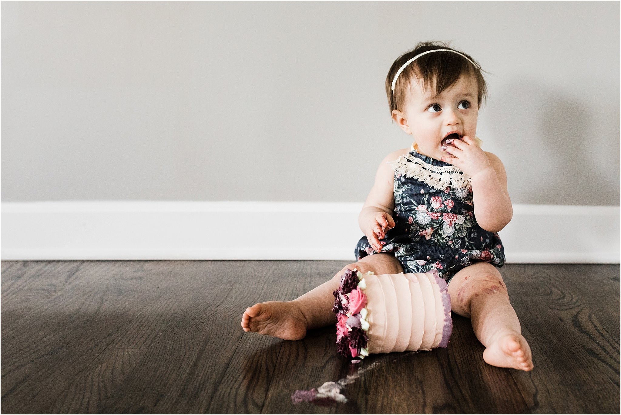 ONE YEAR OLD FLORAL SMASH CAKE AND ROMPER PHOTOS