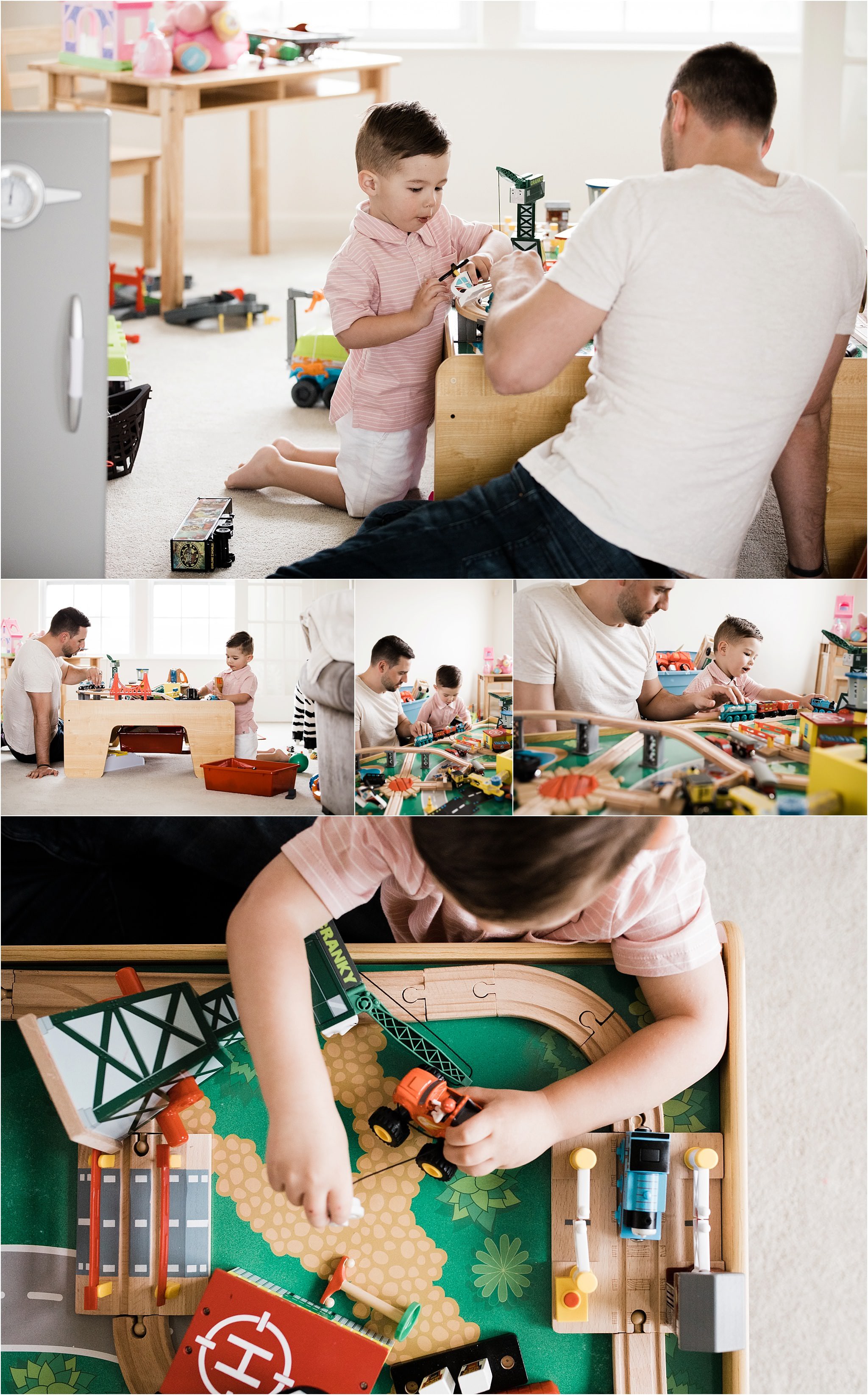 father and son playing with train table at home