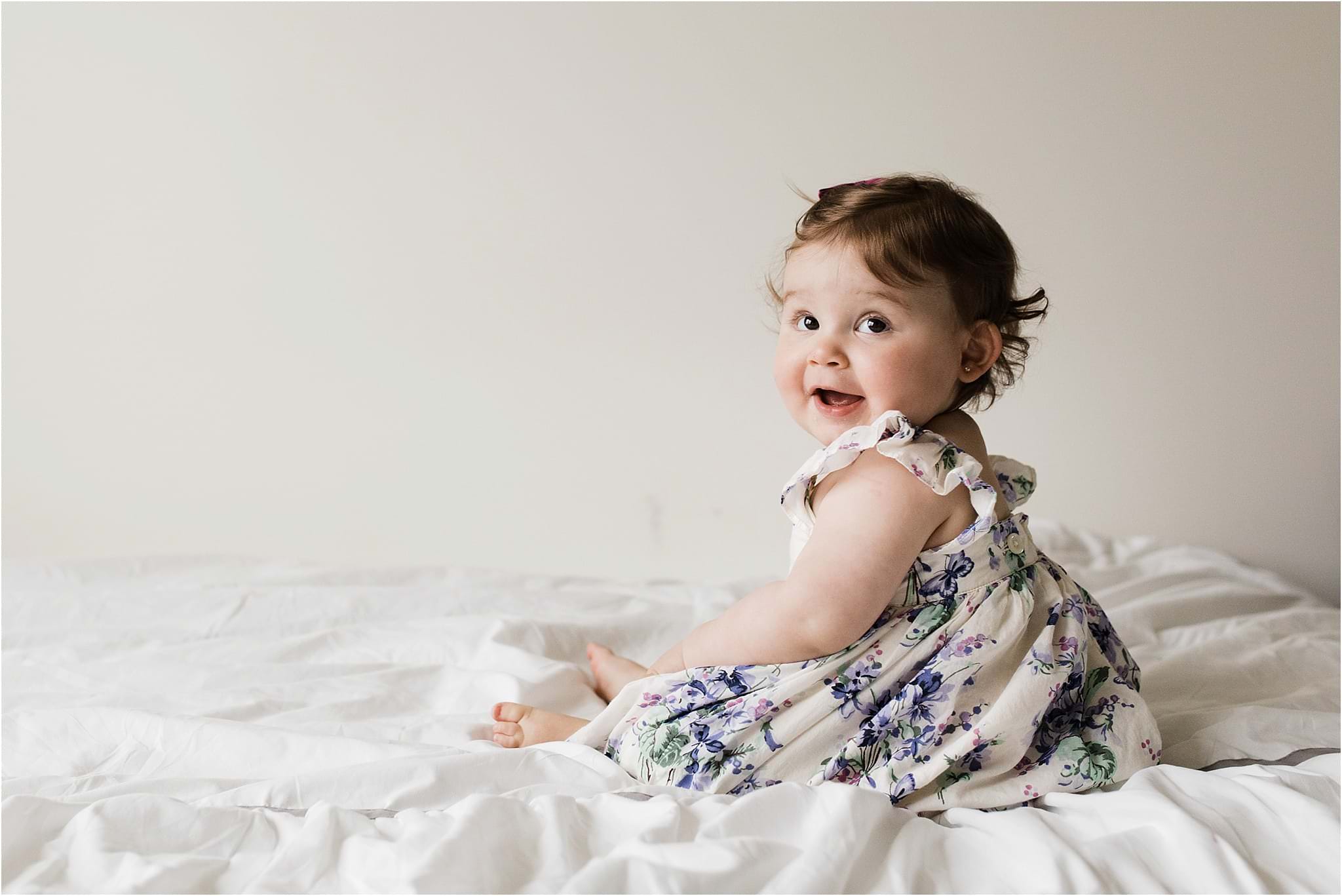one year old girl in floral gap dress
