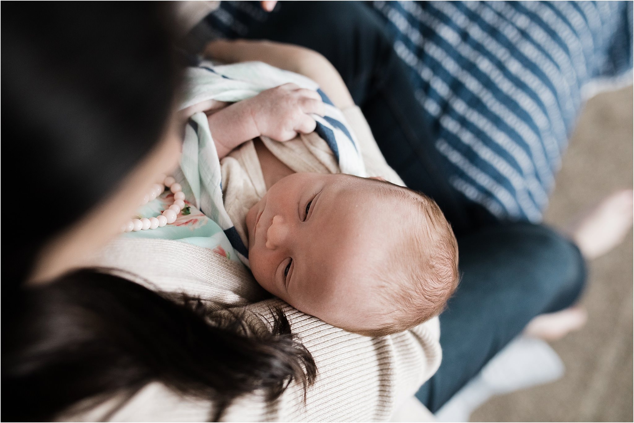 newborn looking at mother